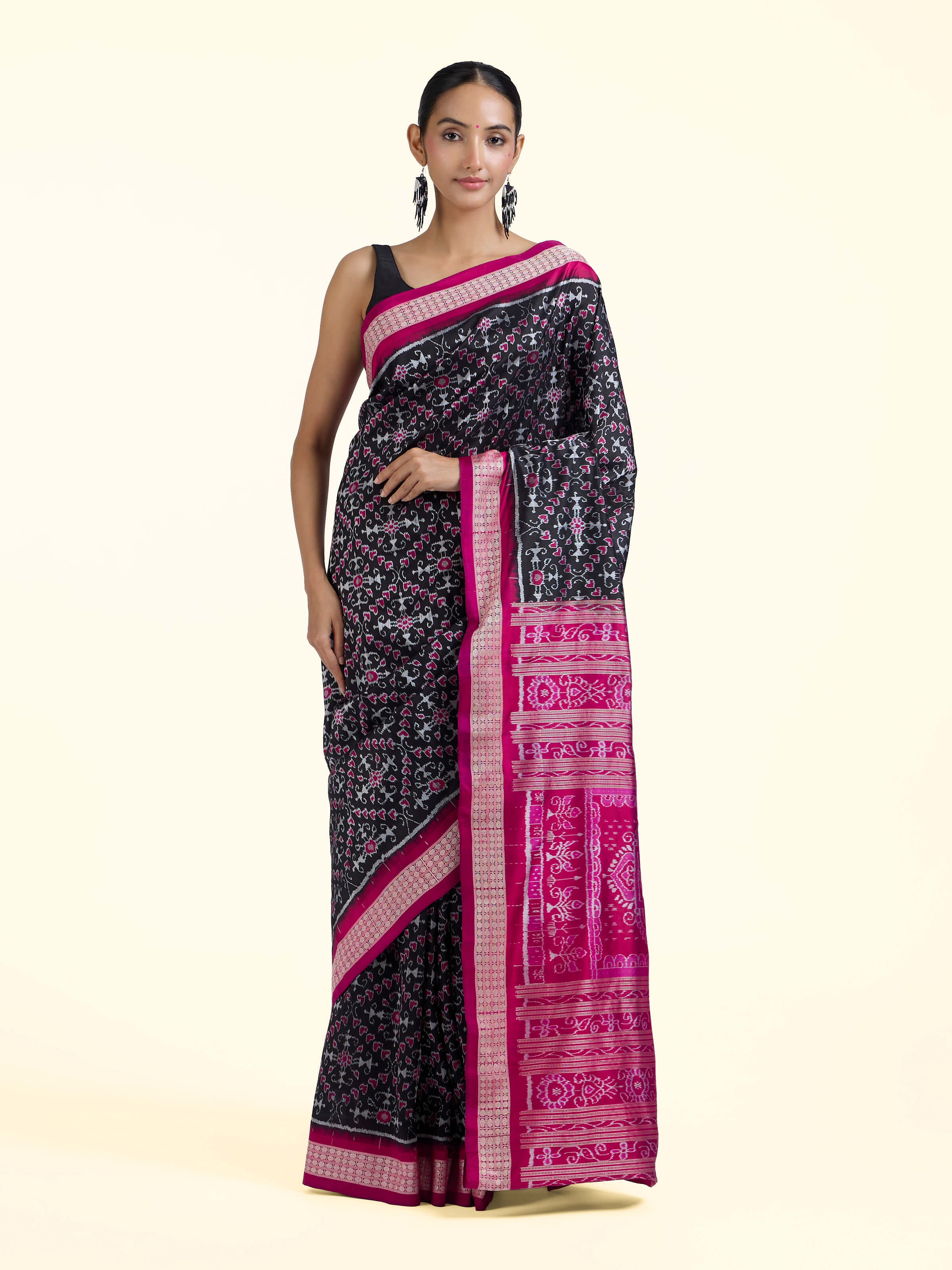 Front view of black mulberry silk Bandha Odisha Ikat saree showcasing bold contrast and traditional Ikat patterns