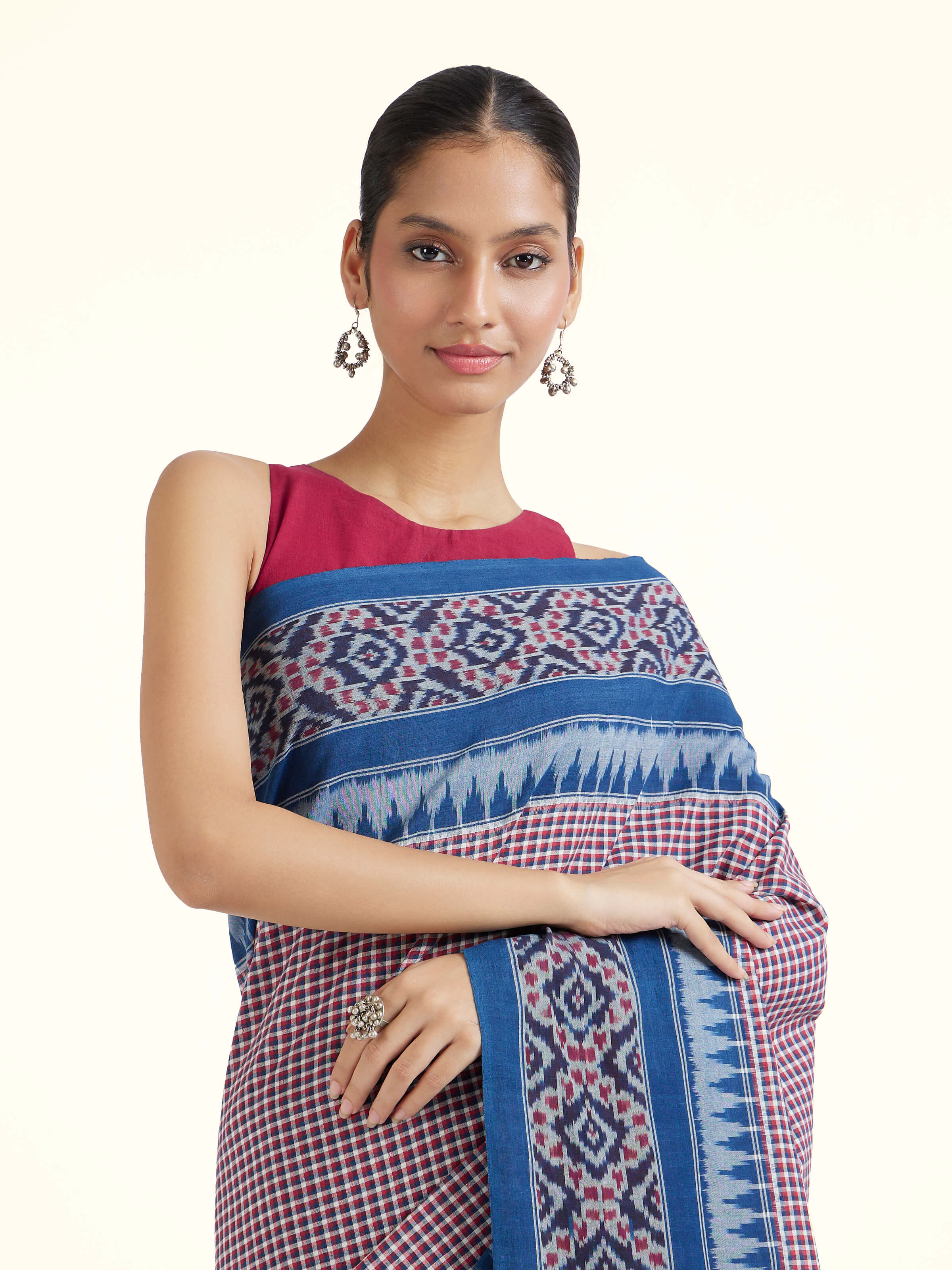 Angled view of indigo natural dyed cotton ikat saree emphasizing hand-dyed weave