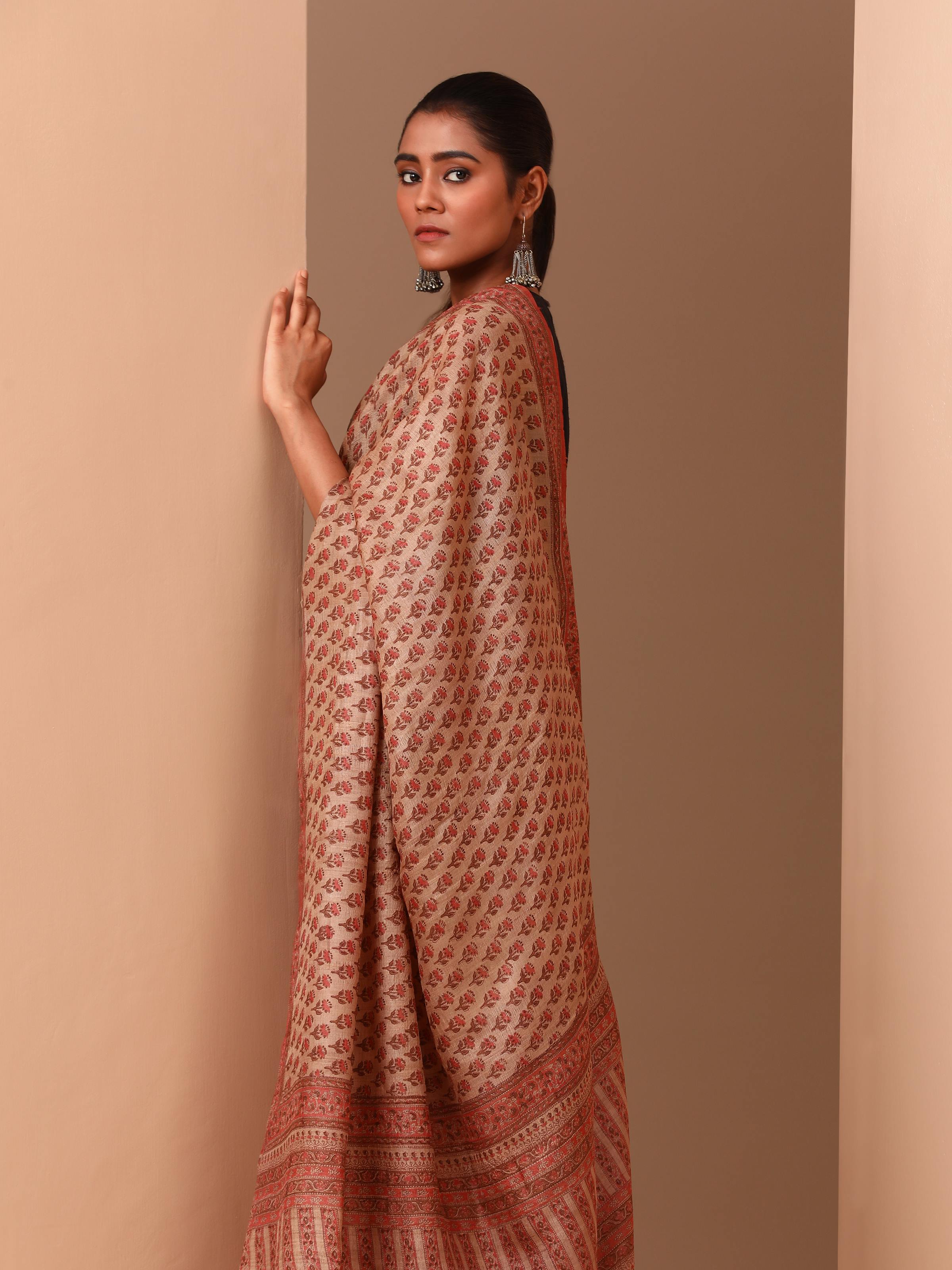 Close-up of motifs and fabric texture of Tussar Muga silk saree