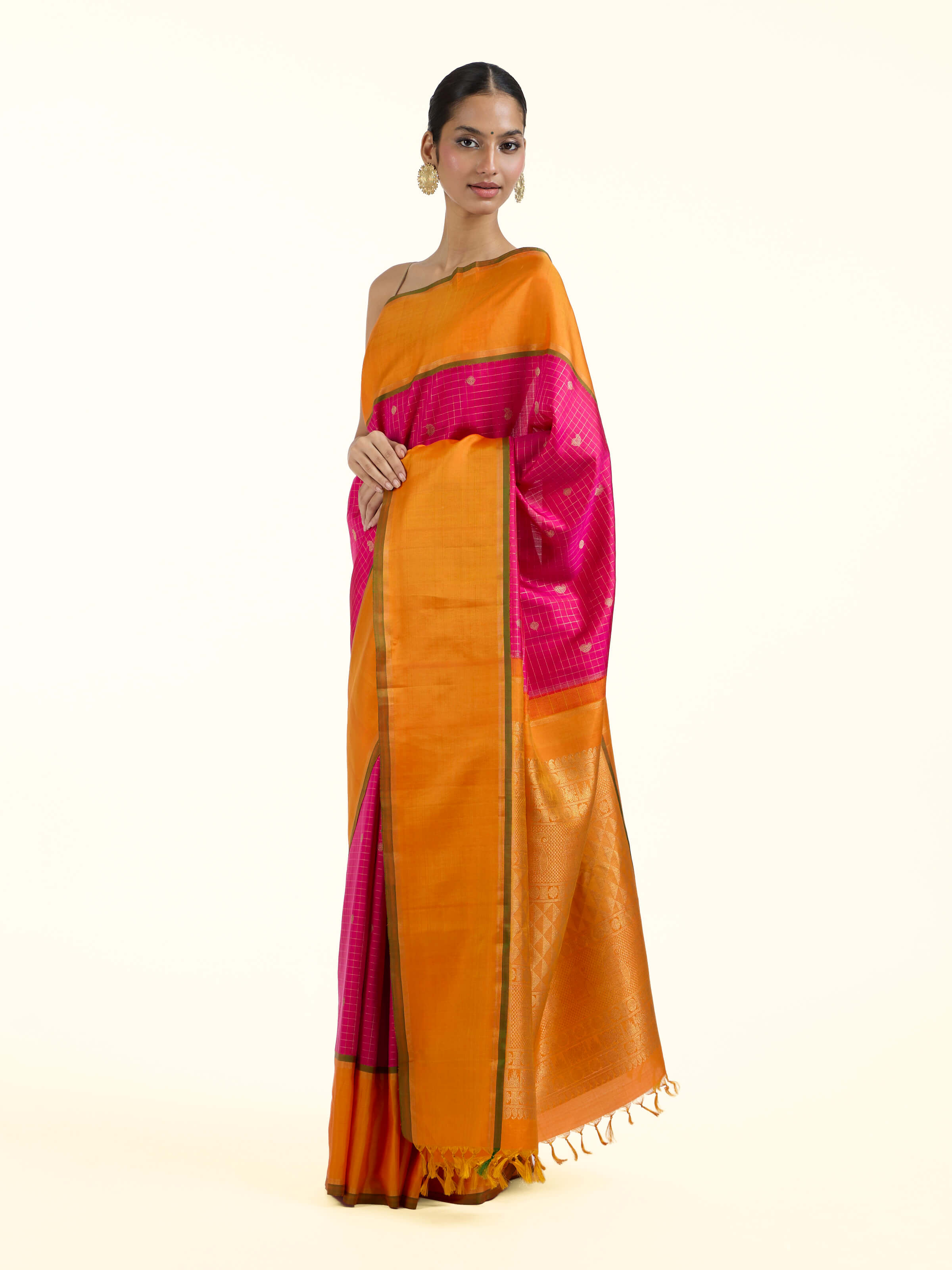 Side view of pink silk Kancheepuram saree with graceful drape and contrast border