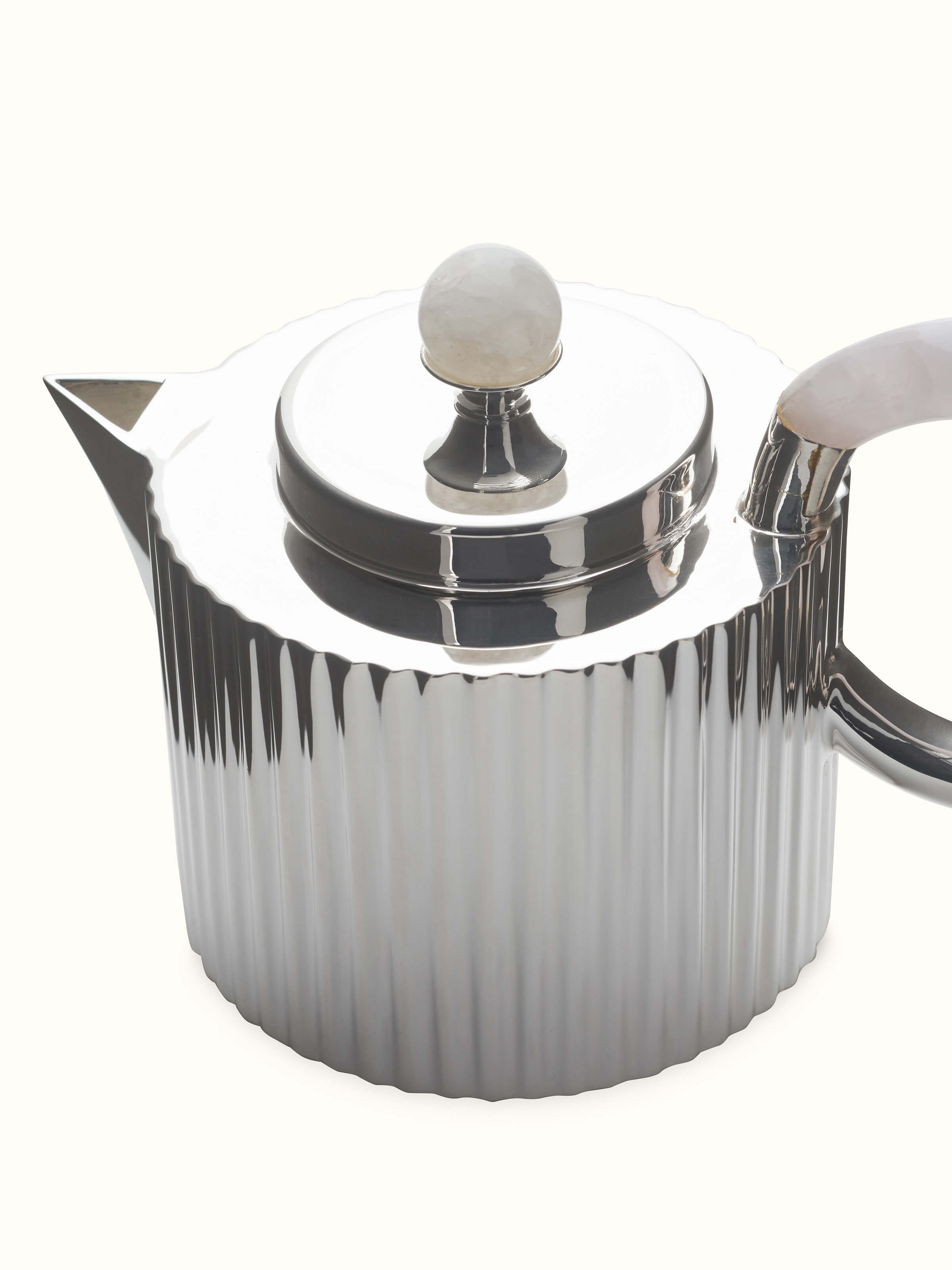 Angled view of Silver Water Reed Tea Set (3 Pcs), capturing the fine details and reflective quality of the silver water reed tea set pieces.