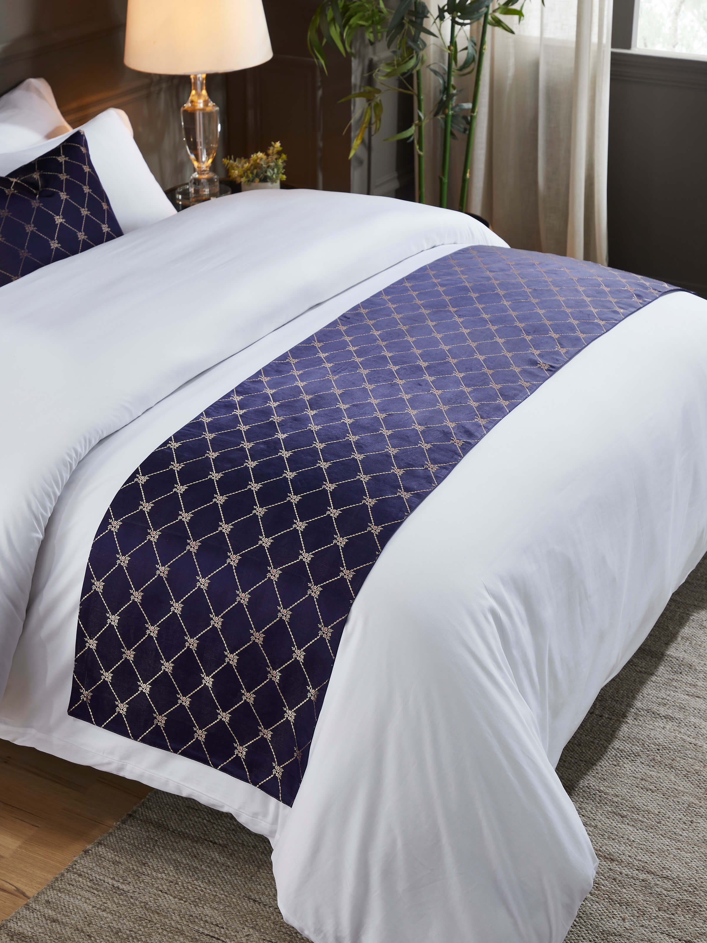 Styled bedroom setting with luxurious handloom silk runner on bed.