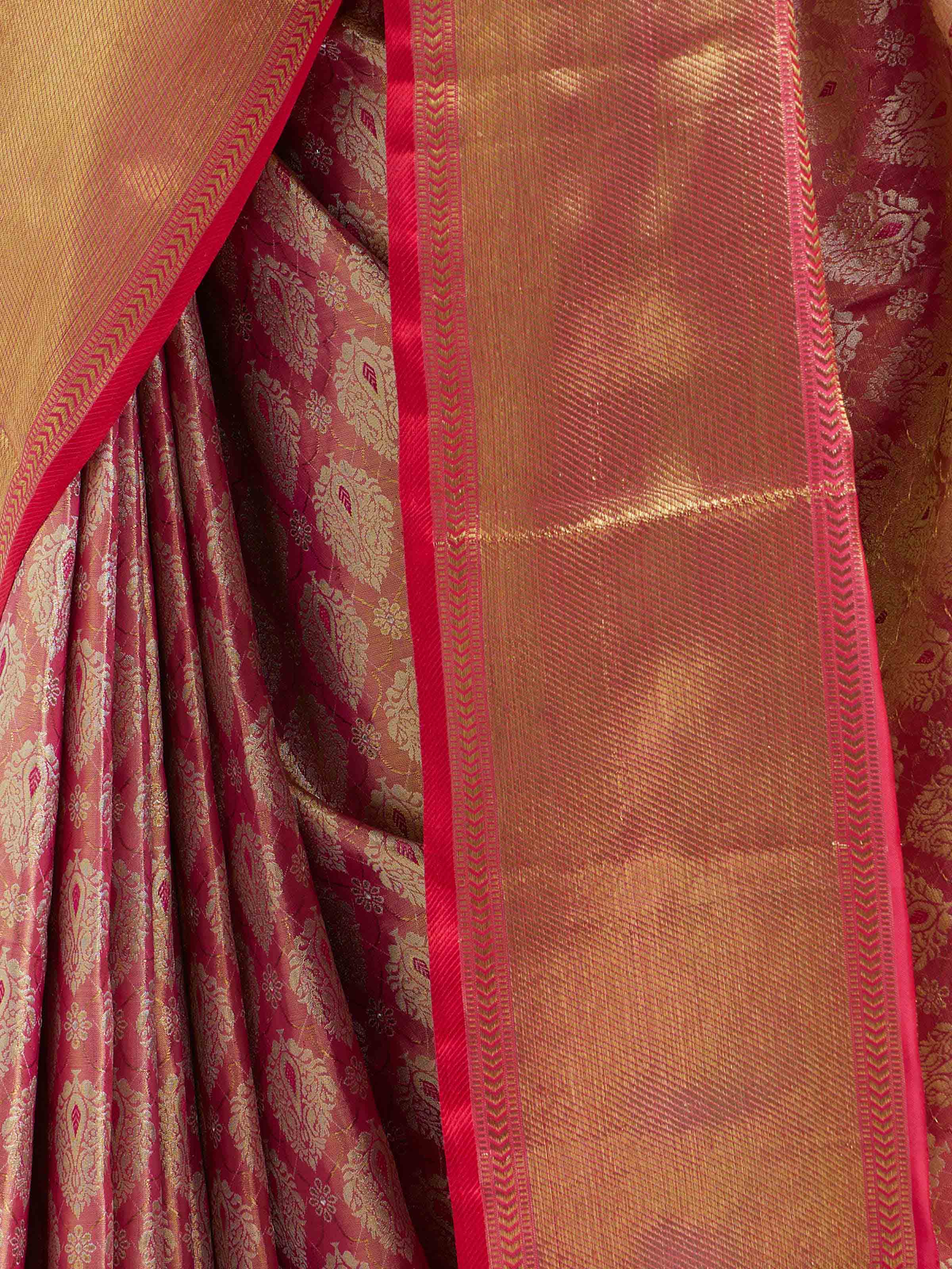 Detail view of pink silk Kancheepuram saree showing silk texture and zari craftsmanship