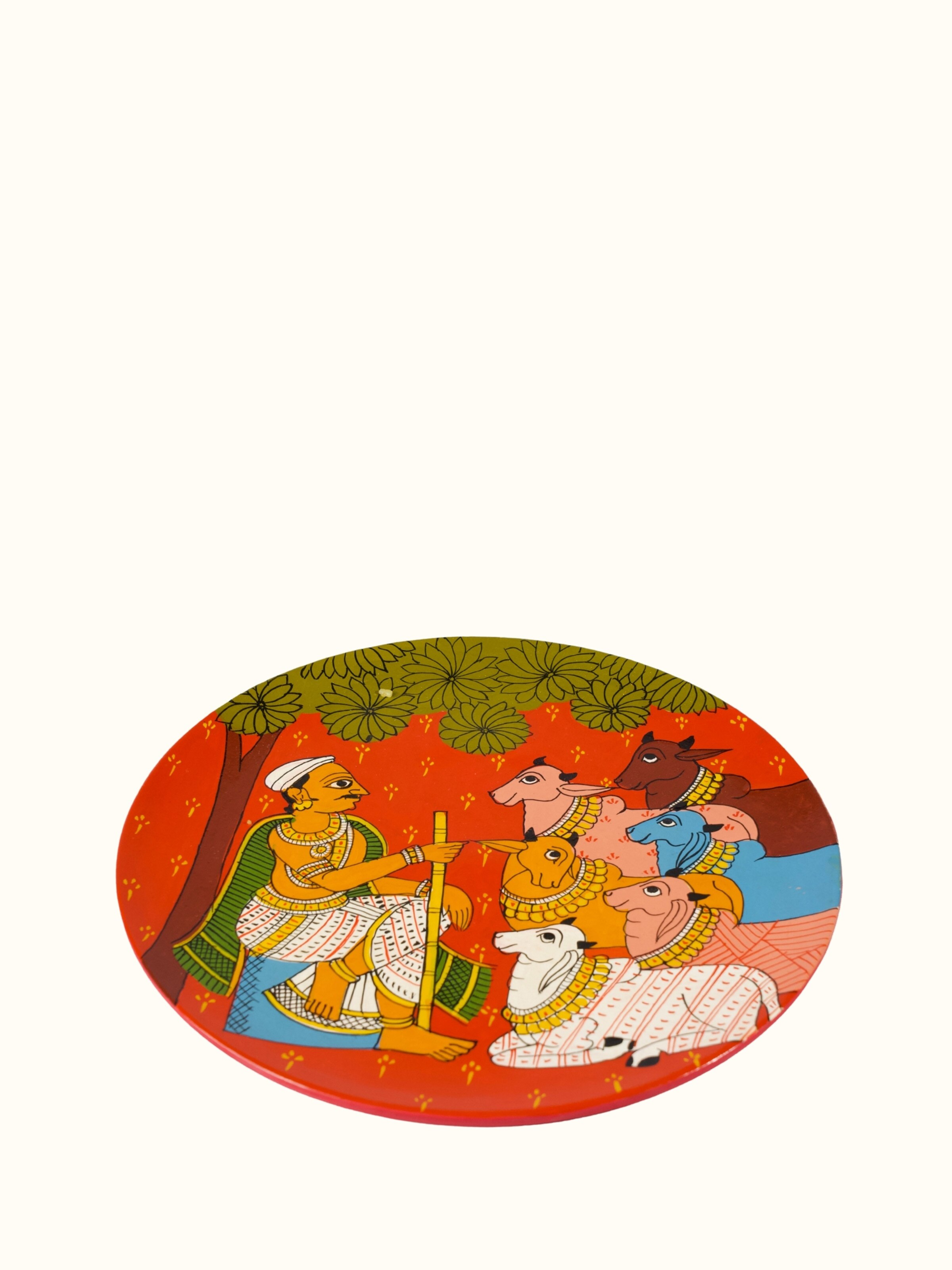 Angled view of Cheriyal Cow Handpainted Display Plate