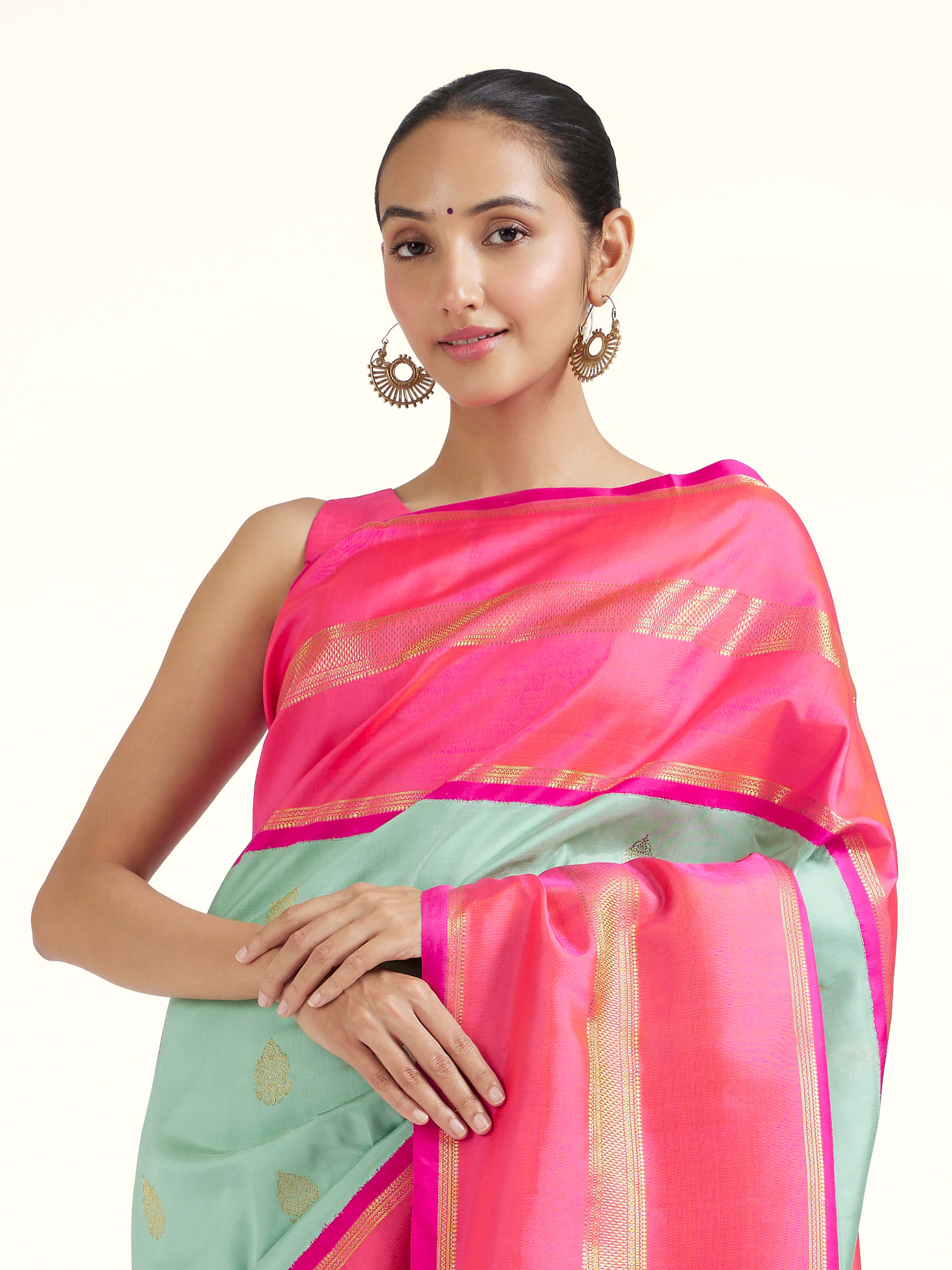 Angled view of light blue silk Kancheepuram saree highlighting traditional weave and sheen