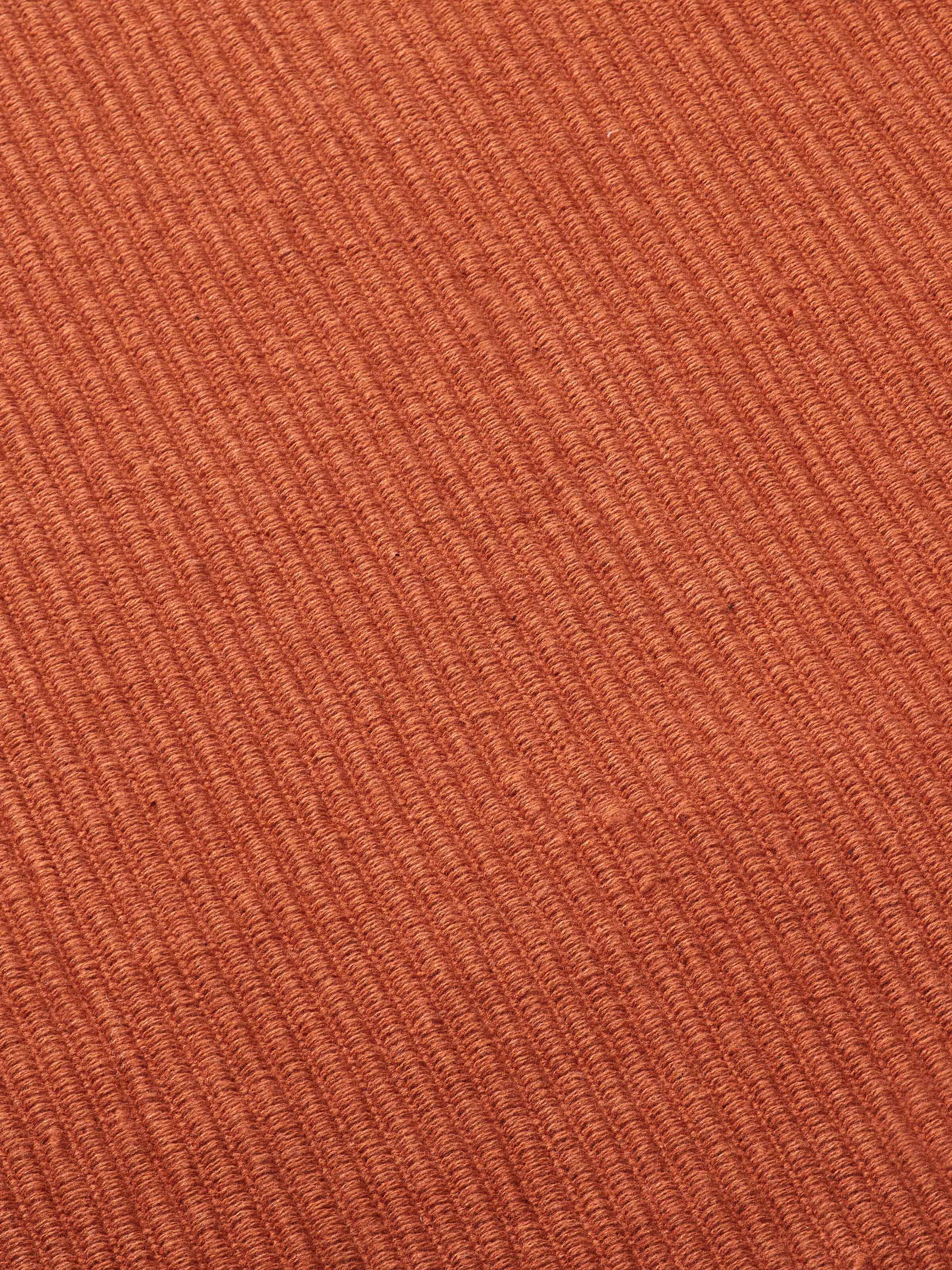Detail image showing the fabric weave and smooth finish
