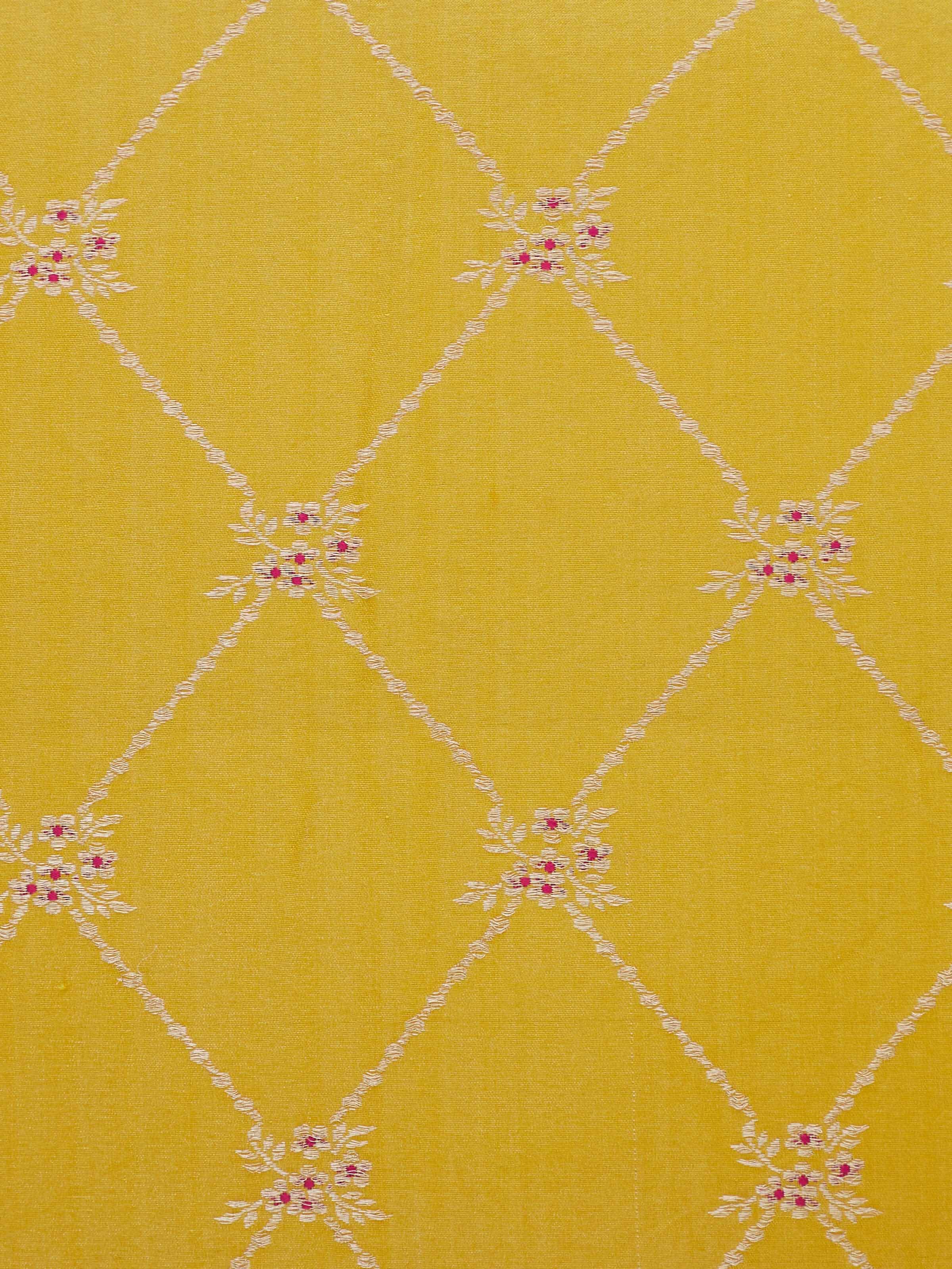 Close-up of Awadh Yellow Banarasi Cushion Cover, highlighting the intricate zari work and rich silk sheen.