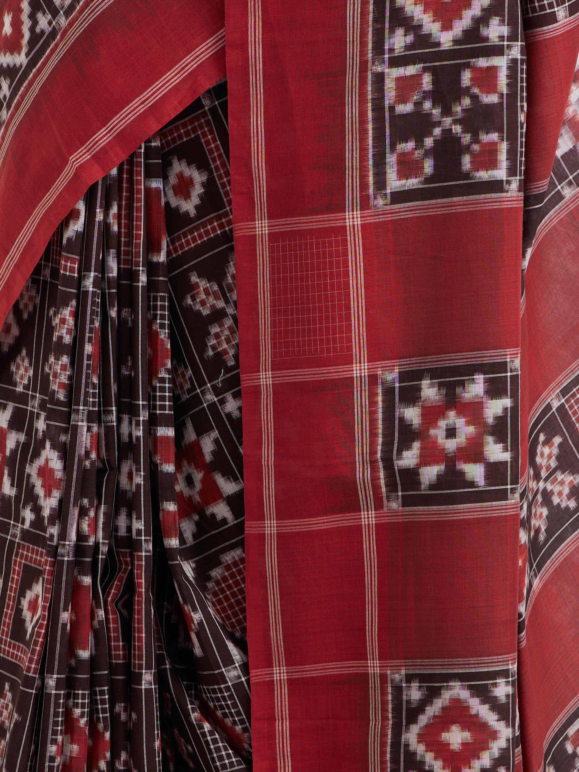 Detail view of madder red cotton double ikat saree showcasing intricate craftsmanship