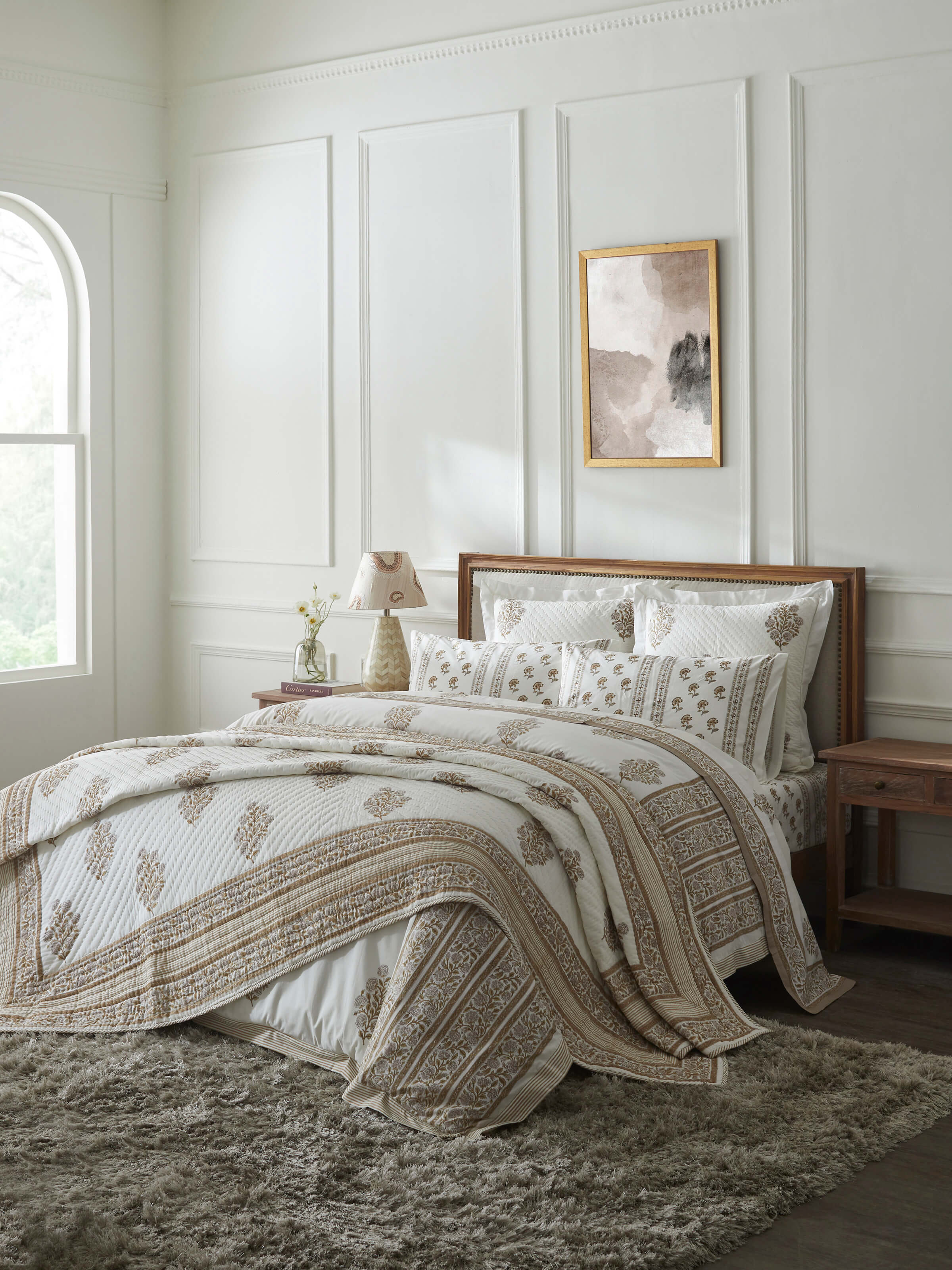 Saha beige buta Sanganeri hand block printed cotton double quilt laid on bed