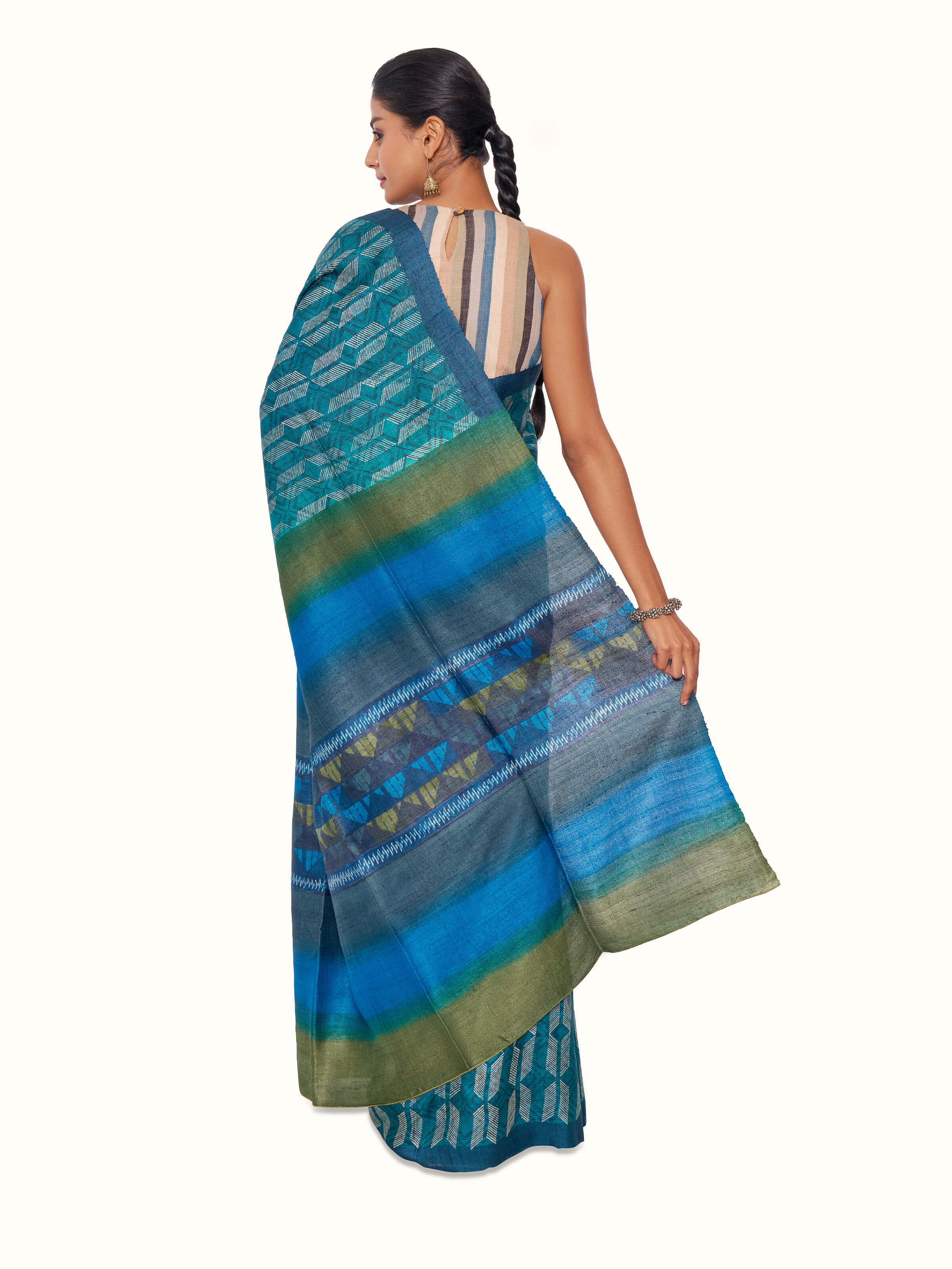 Back view of sea green tussar silk discharge block printed saree displaying pallu design