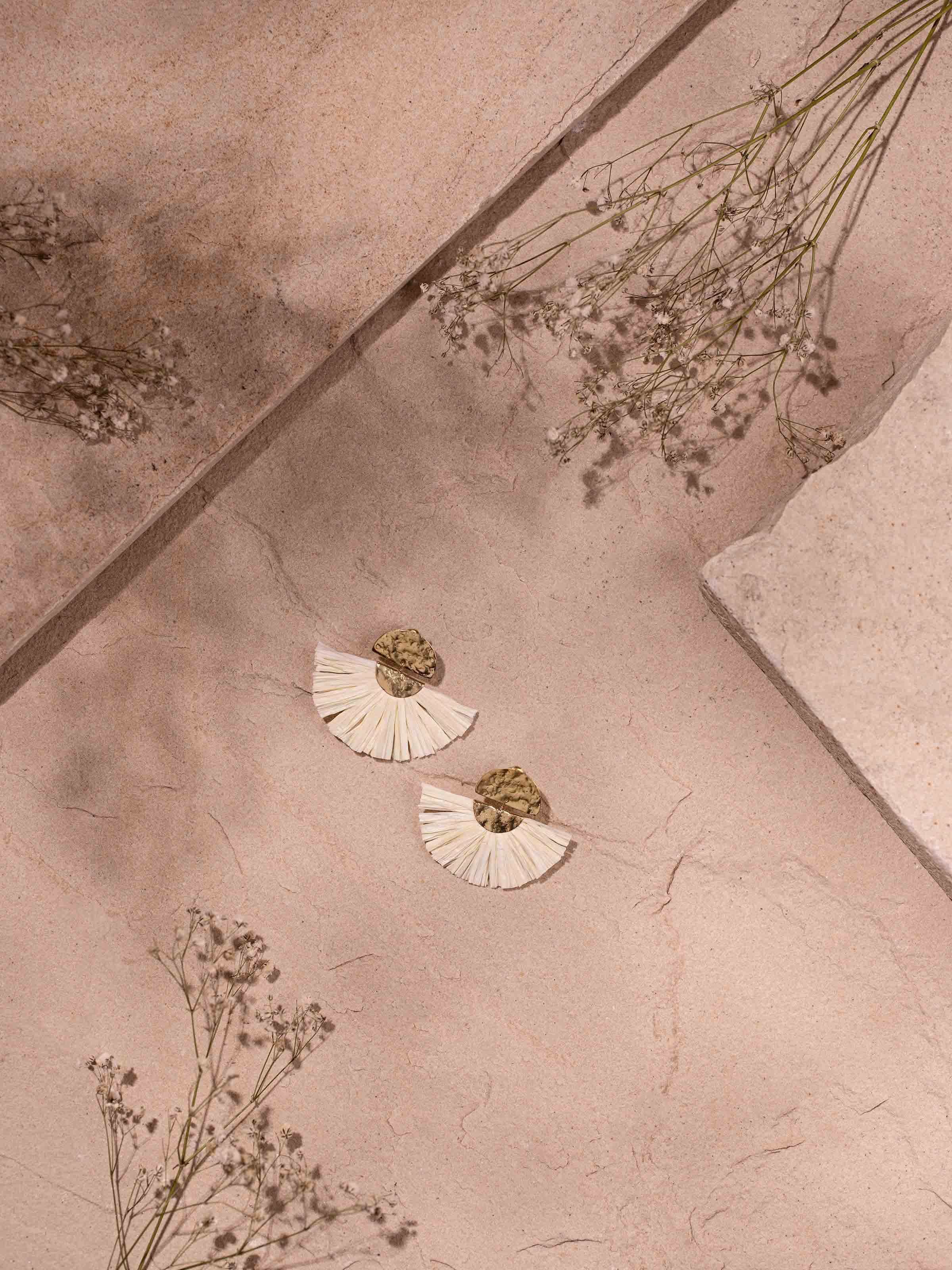 Side view of Raffia Fibre Drop Earrings highlighting their detailed craftsmanship and stylish design.