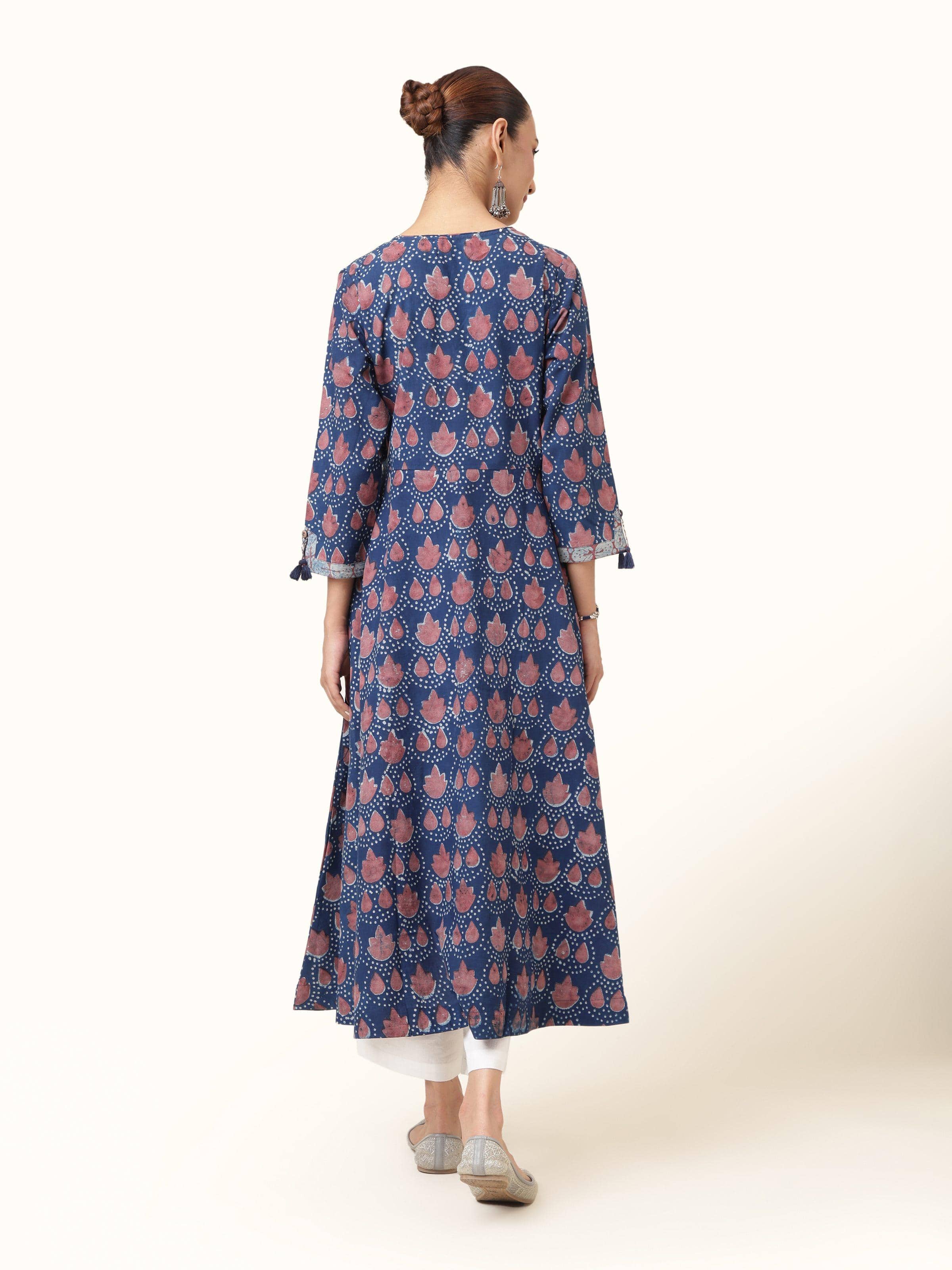 Back view of blue cotton Dabu block print A-line kurta displaying neckline and stitching.
