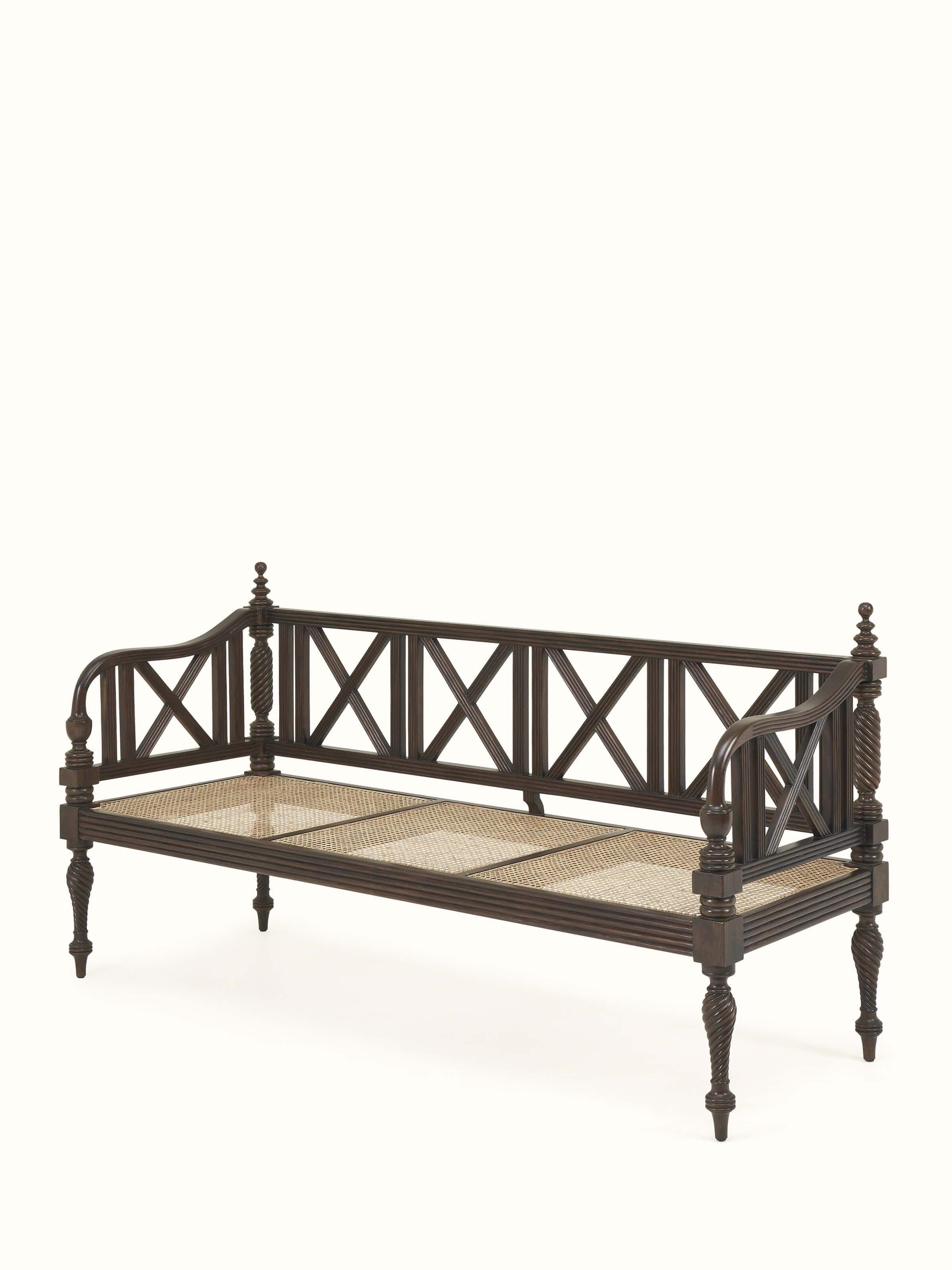 Angle view of Walnut finish Mahogany wood and cane sofa focusing on timeless aesthetics and comfort