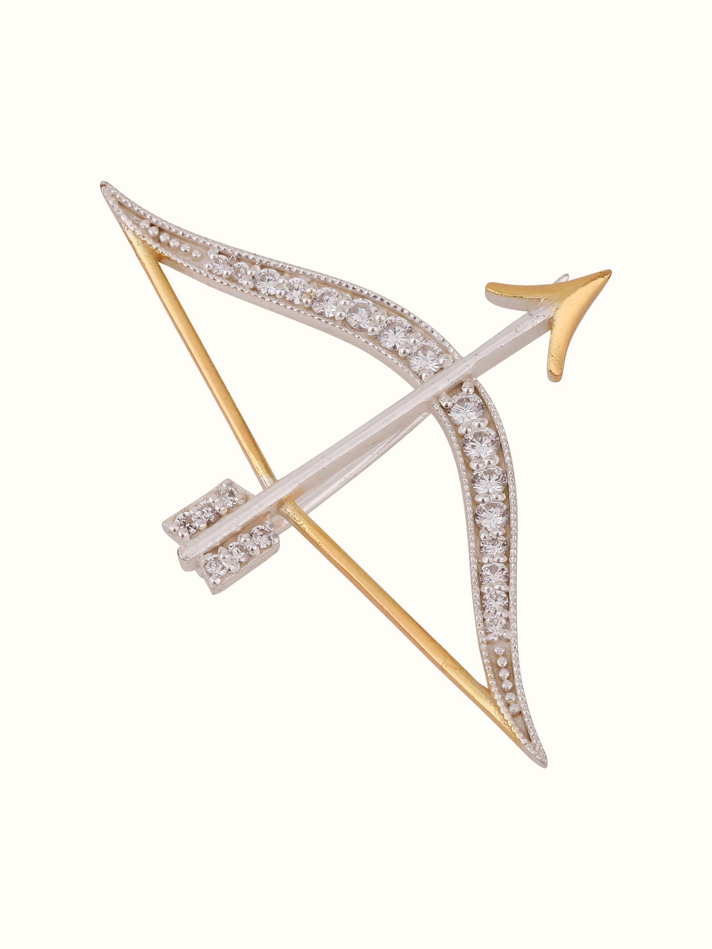 Overhead view of silver brooch laid flat to highlight shape and dimension