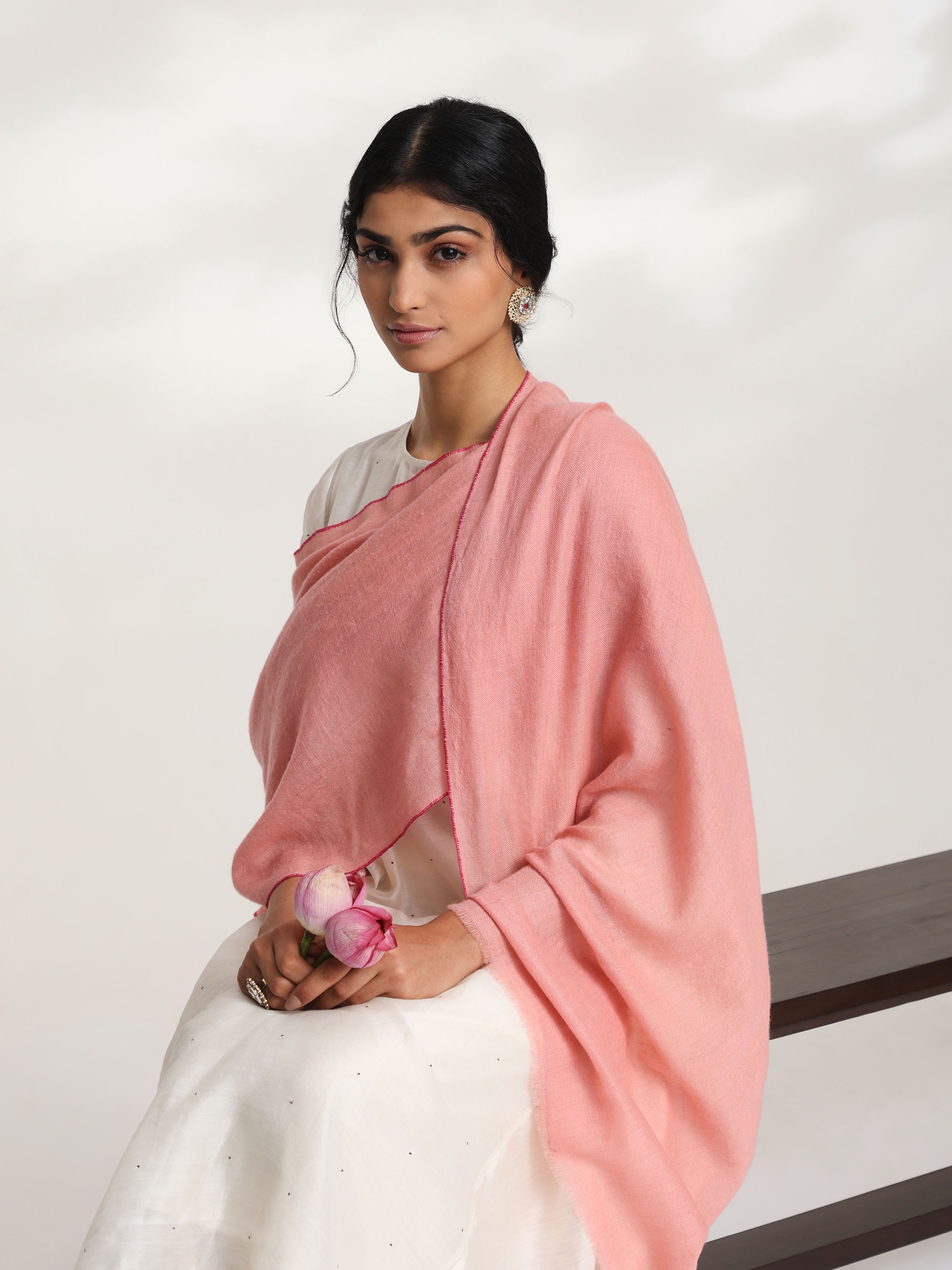 Angled view of pink cashmere kaaj embroidered handwoven stole highlighting texture and design