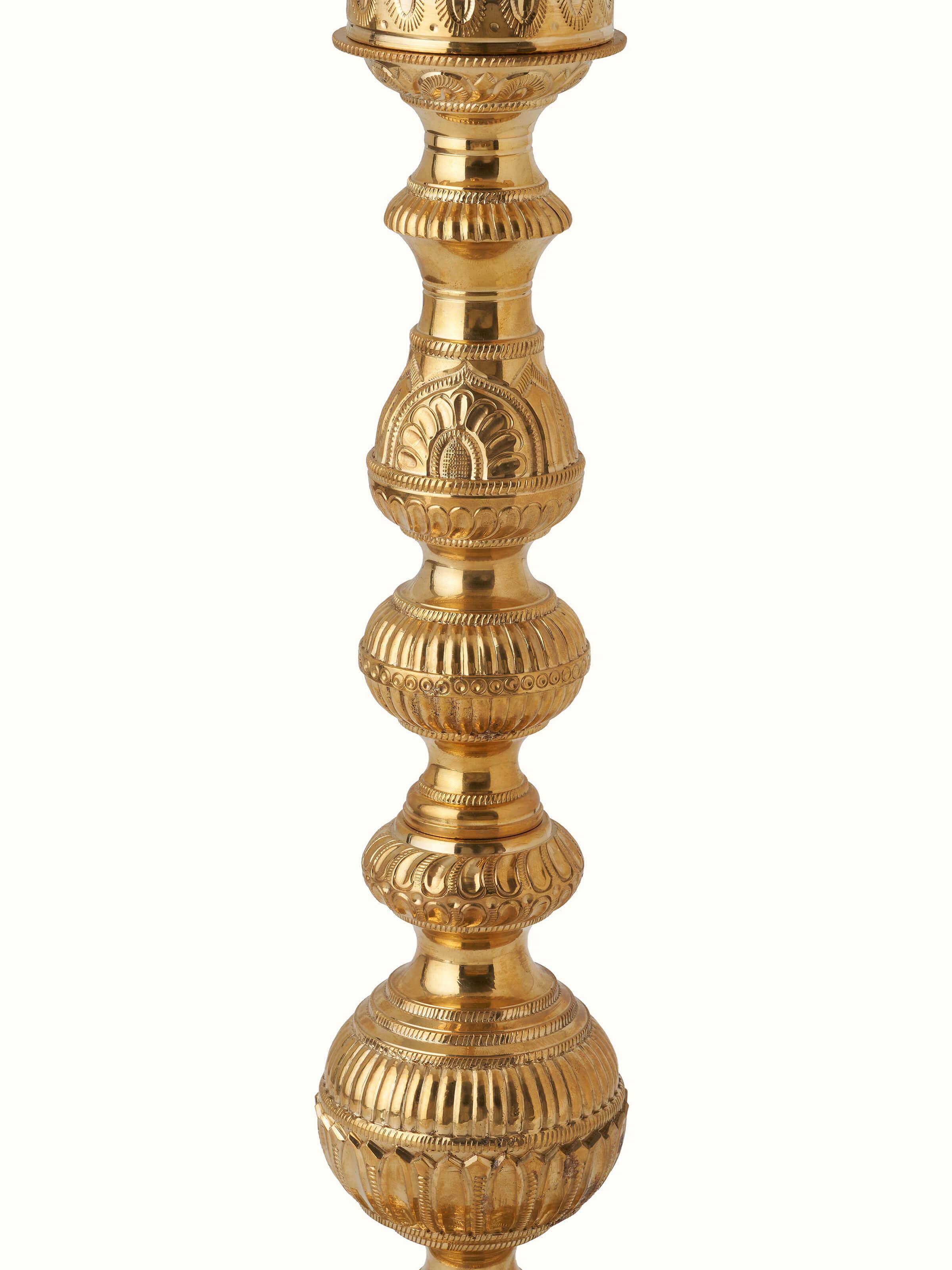 Detailed view of Vilakku Carved Brass Stand Diya showcasing the craftsmanship of the carving.