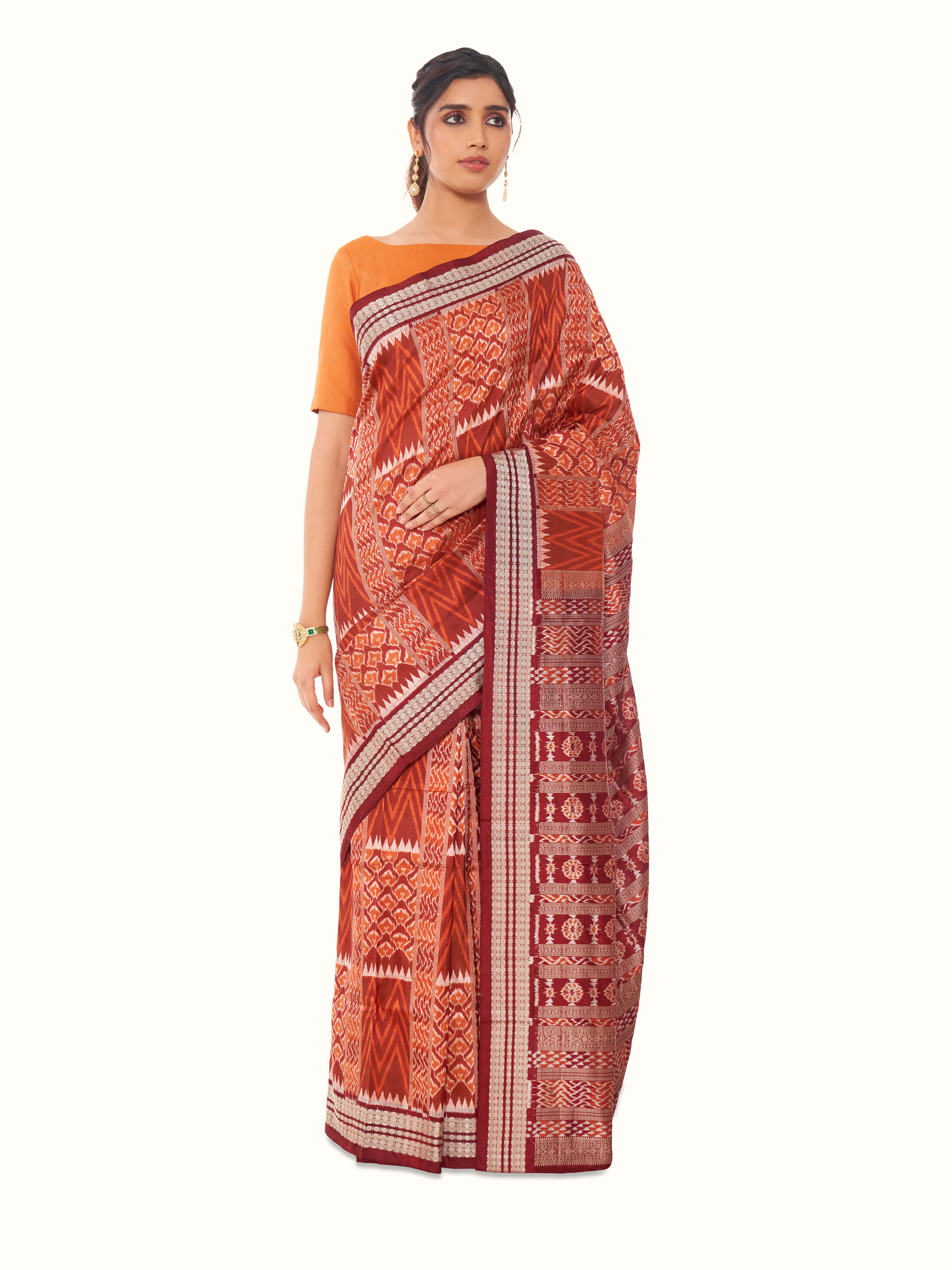 Front view of brown mulberry silk bandha Odisha saree with traditional patterns