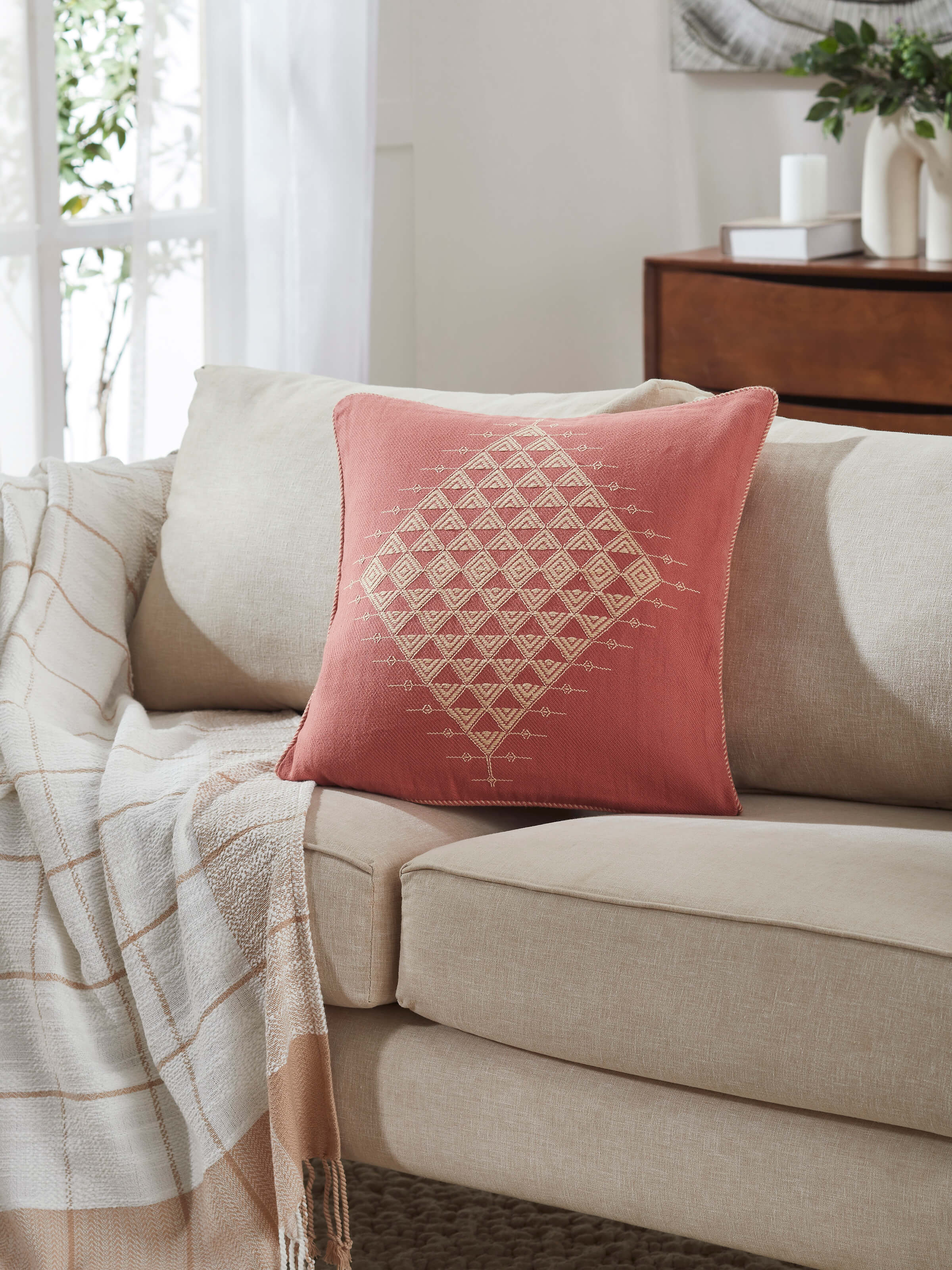 Side view of Godna Peach Twill Cotton Handwoven Pattu Cushion Cover highlighting the weave pattern and stitching details