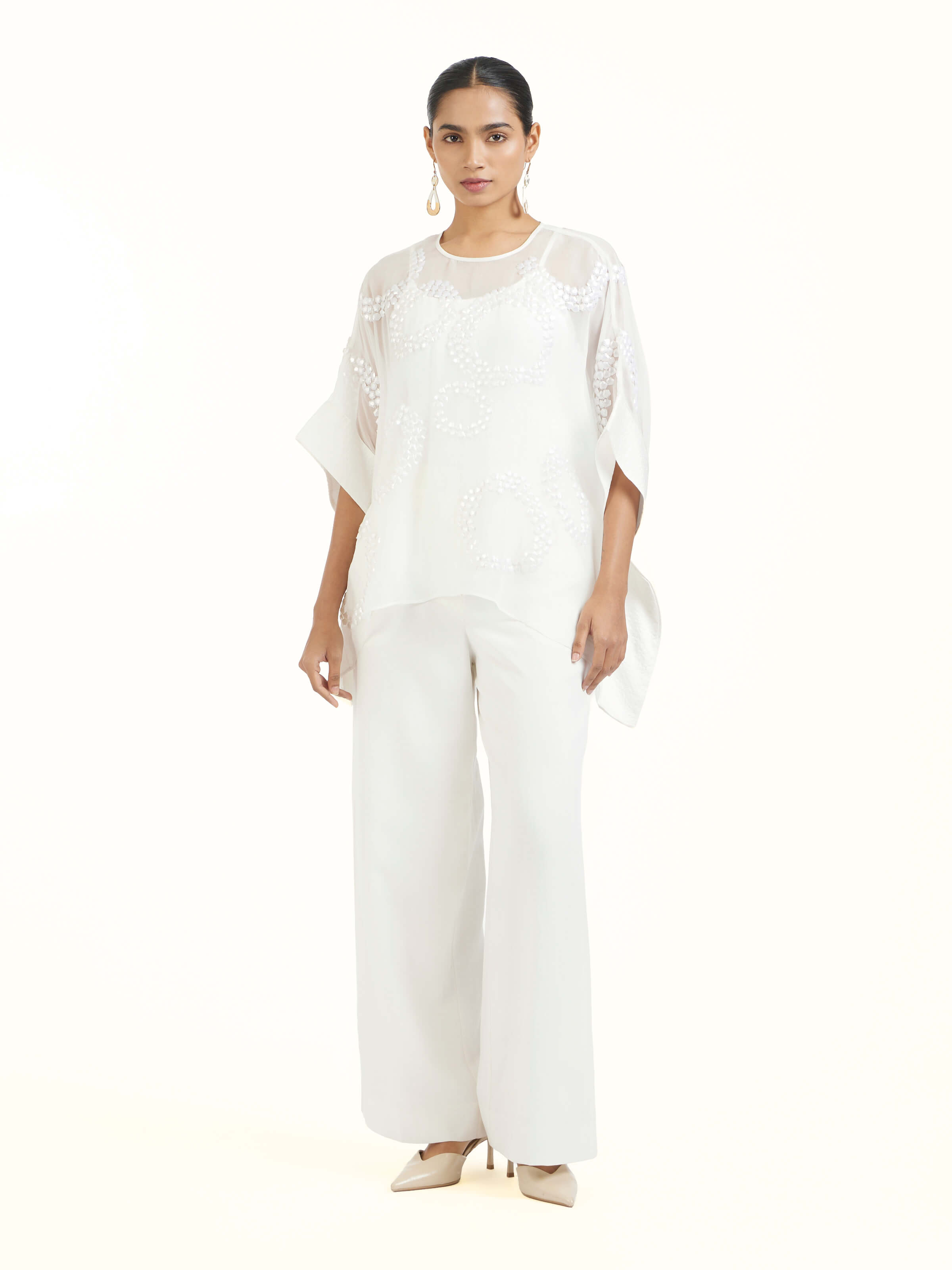 Front view of ivory hand embroidered organza kaftan showcasing delicate embroidery and refined silhouette