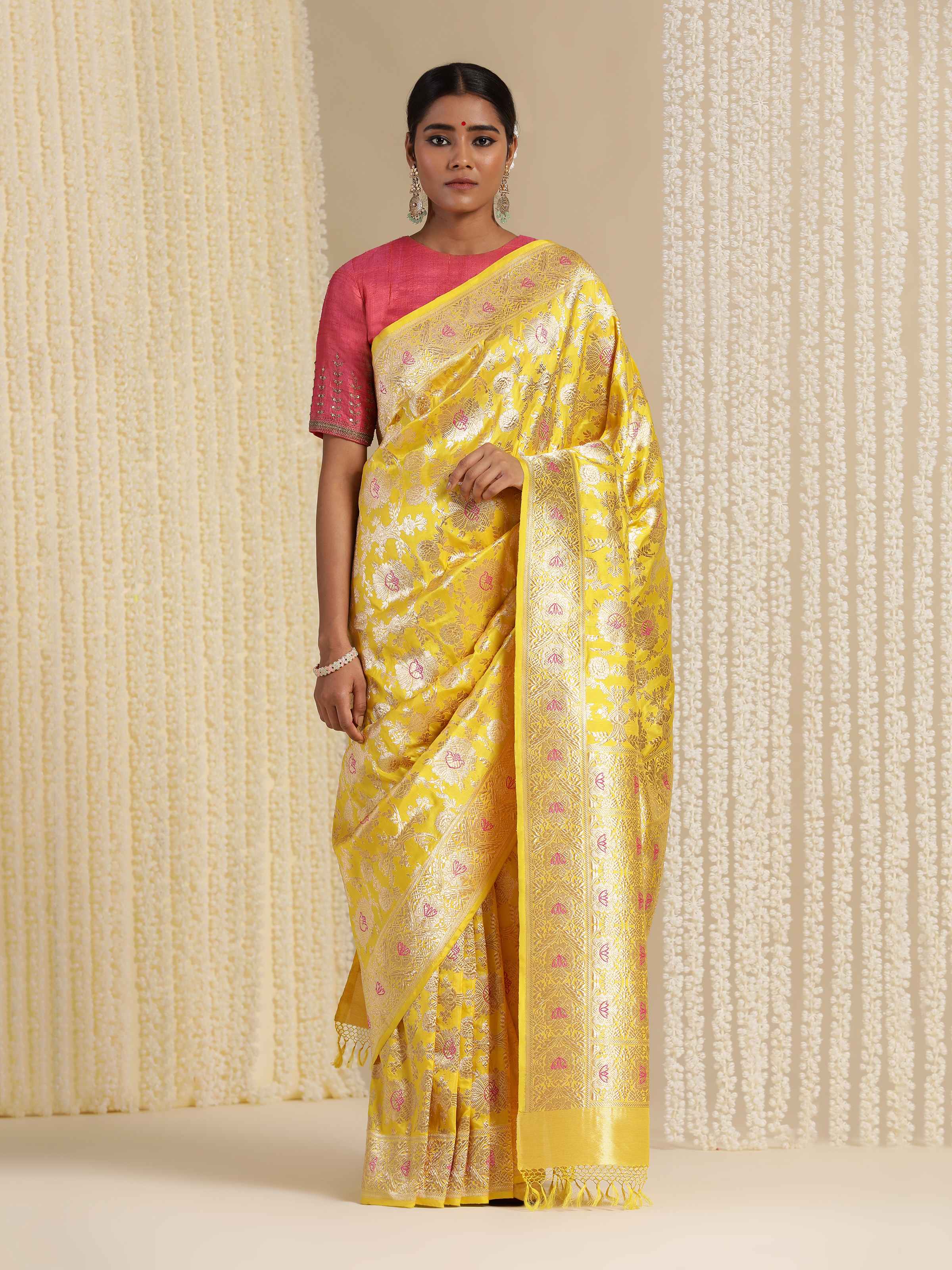 Alternate front view showcasing zari work on yellow mulberry Katan silk Banarasi saree