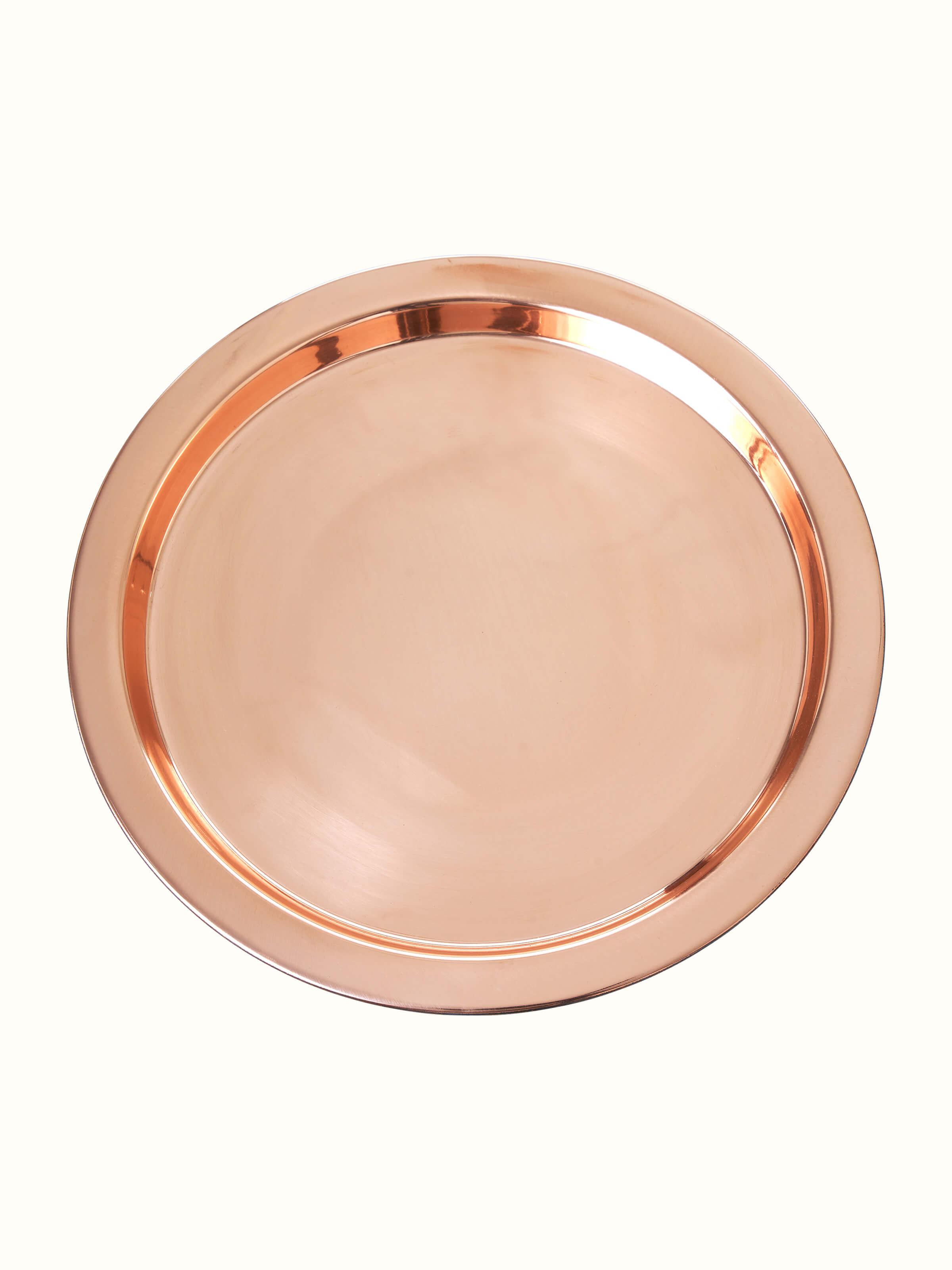 Polished Copperware Pooja Thali Set (4 pcs) from an angle, emphasizing its elegant design