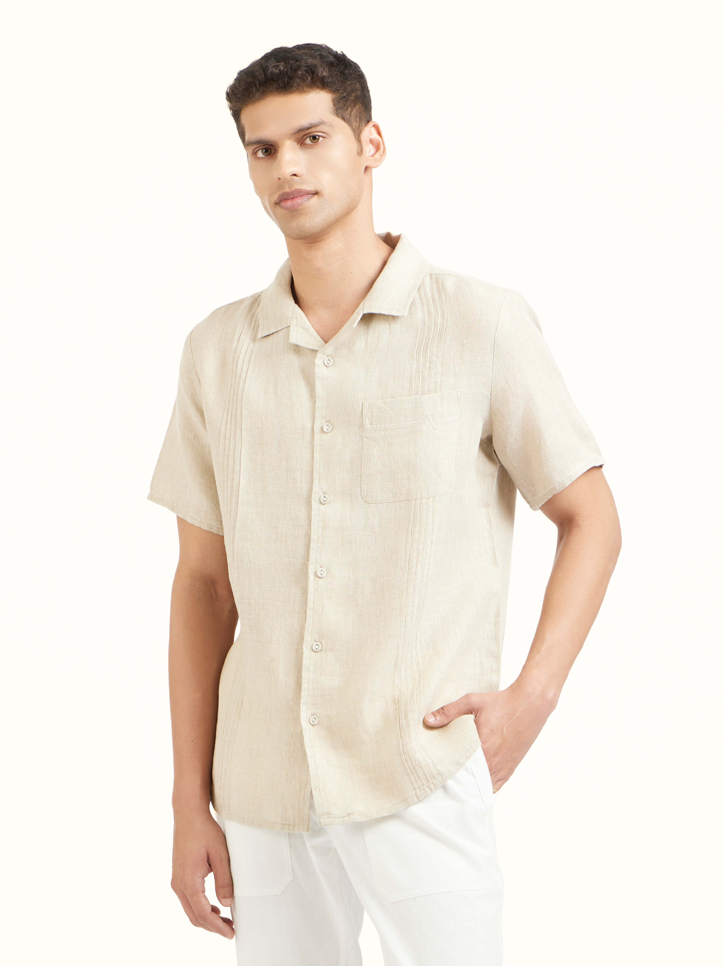 Angled view of beige Cuban collar linen shirt highlighting linen texture