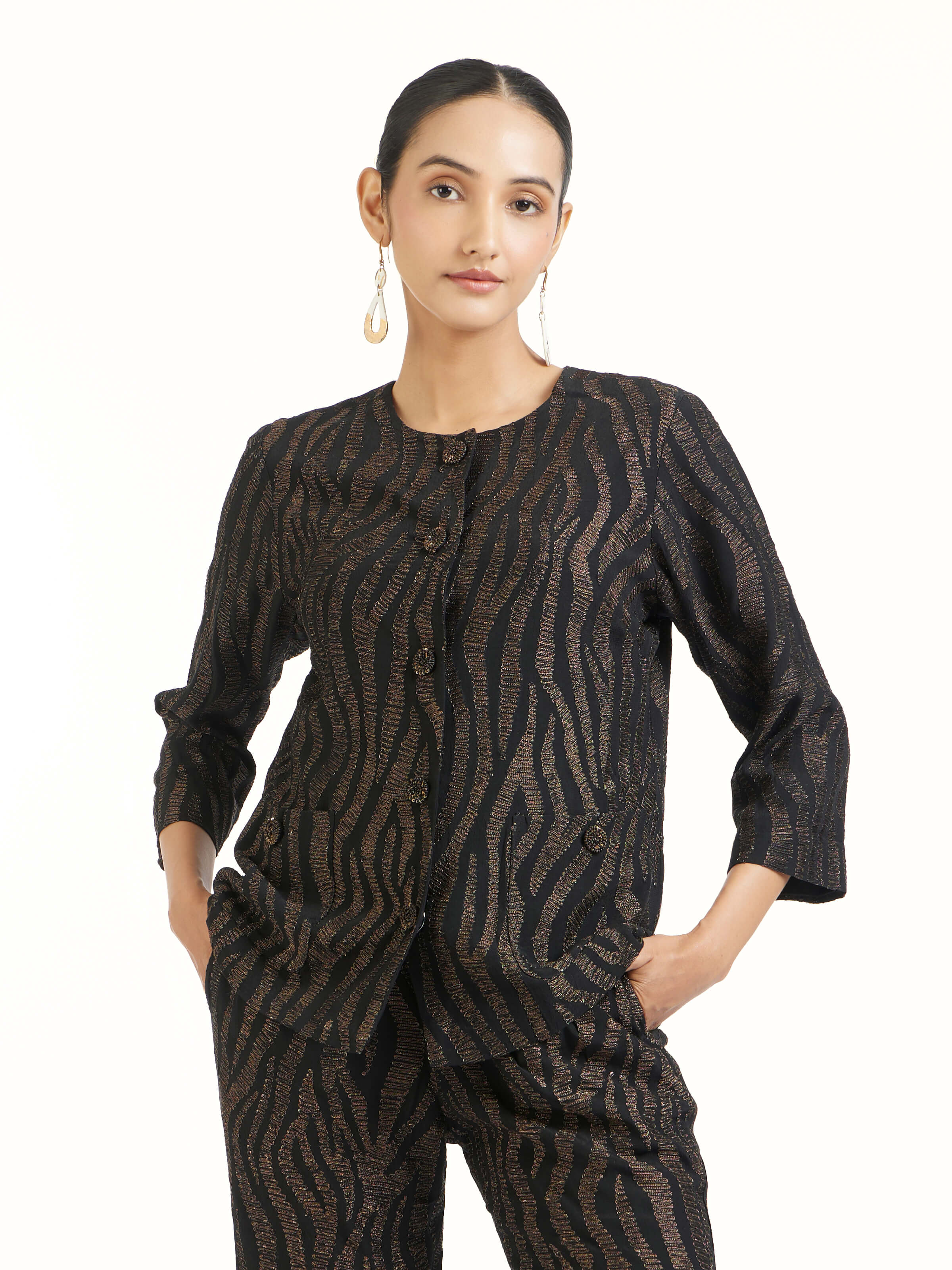 Angled view of black aari hand embroidered jacket emphasizing handcrafted aari work