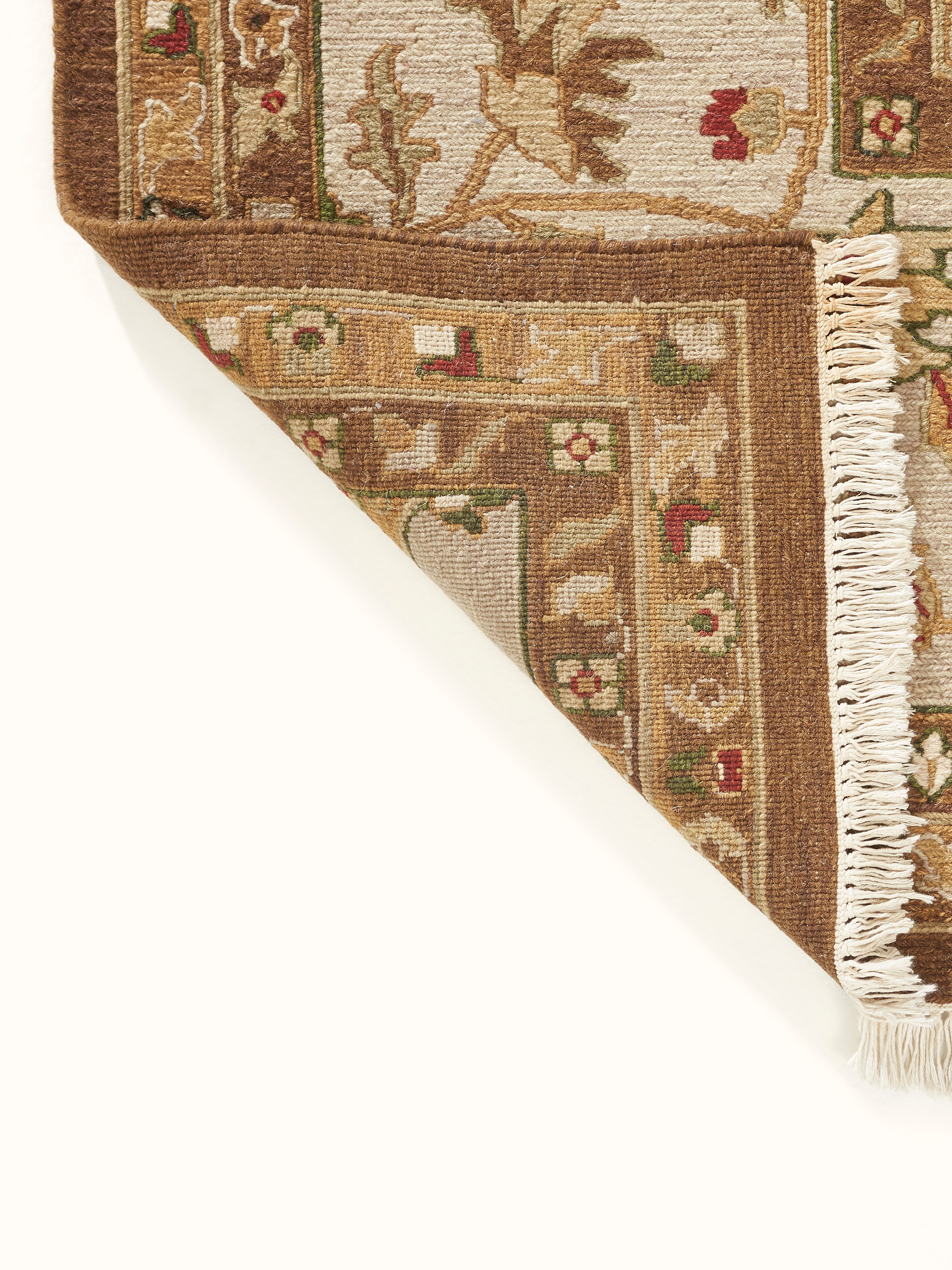 Close-up of Traditional Sumak brown chobi Bhadohi wool hand-knotted rug detailing the pattern and wool fibers.