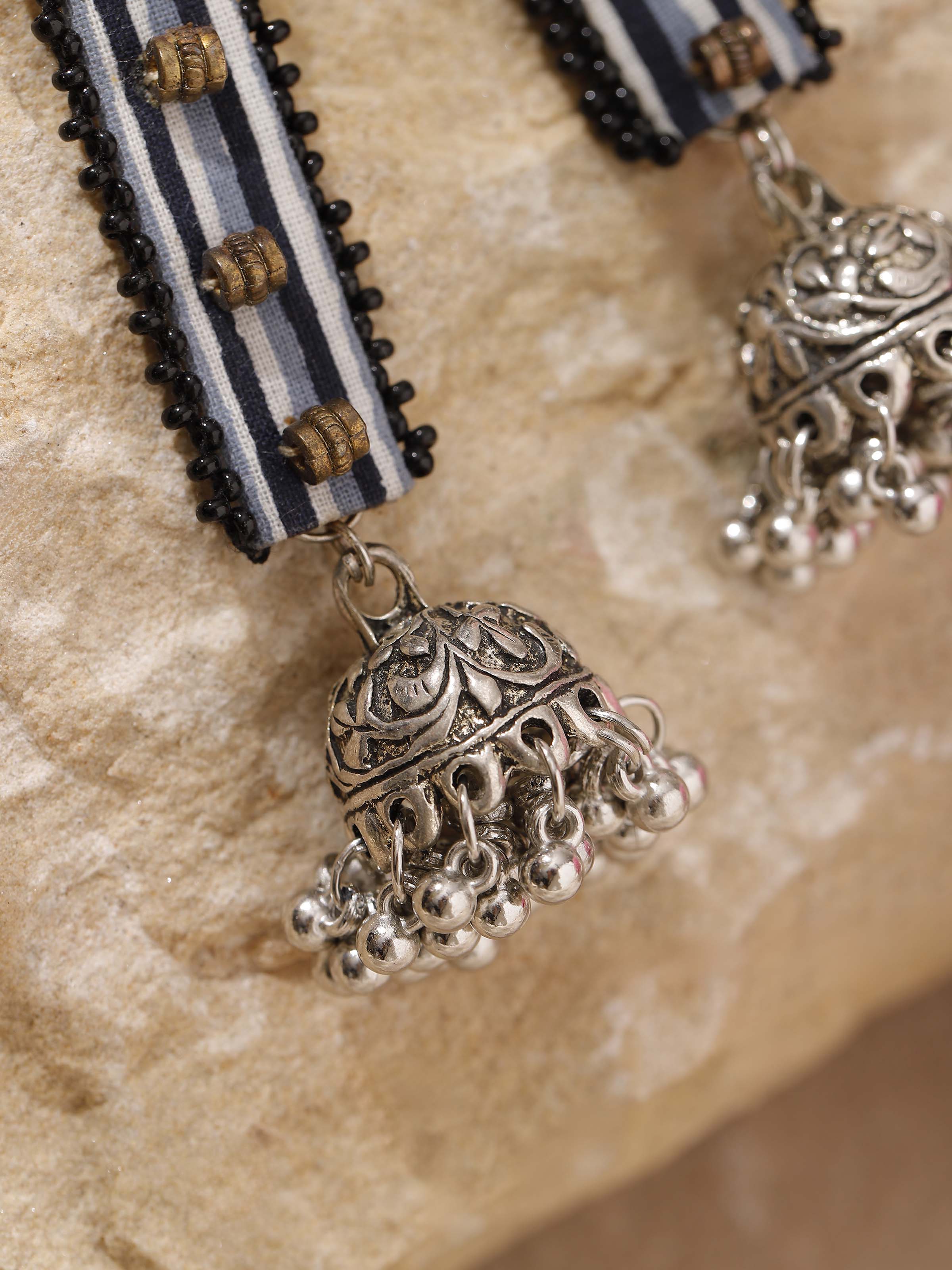 Detailed view of Ajrakh Drop Earrings emphasizing traditional embroidery by Swadesh