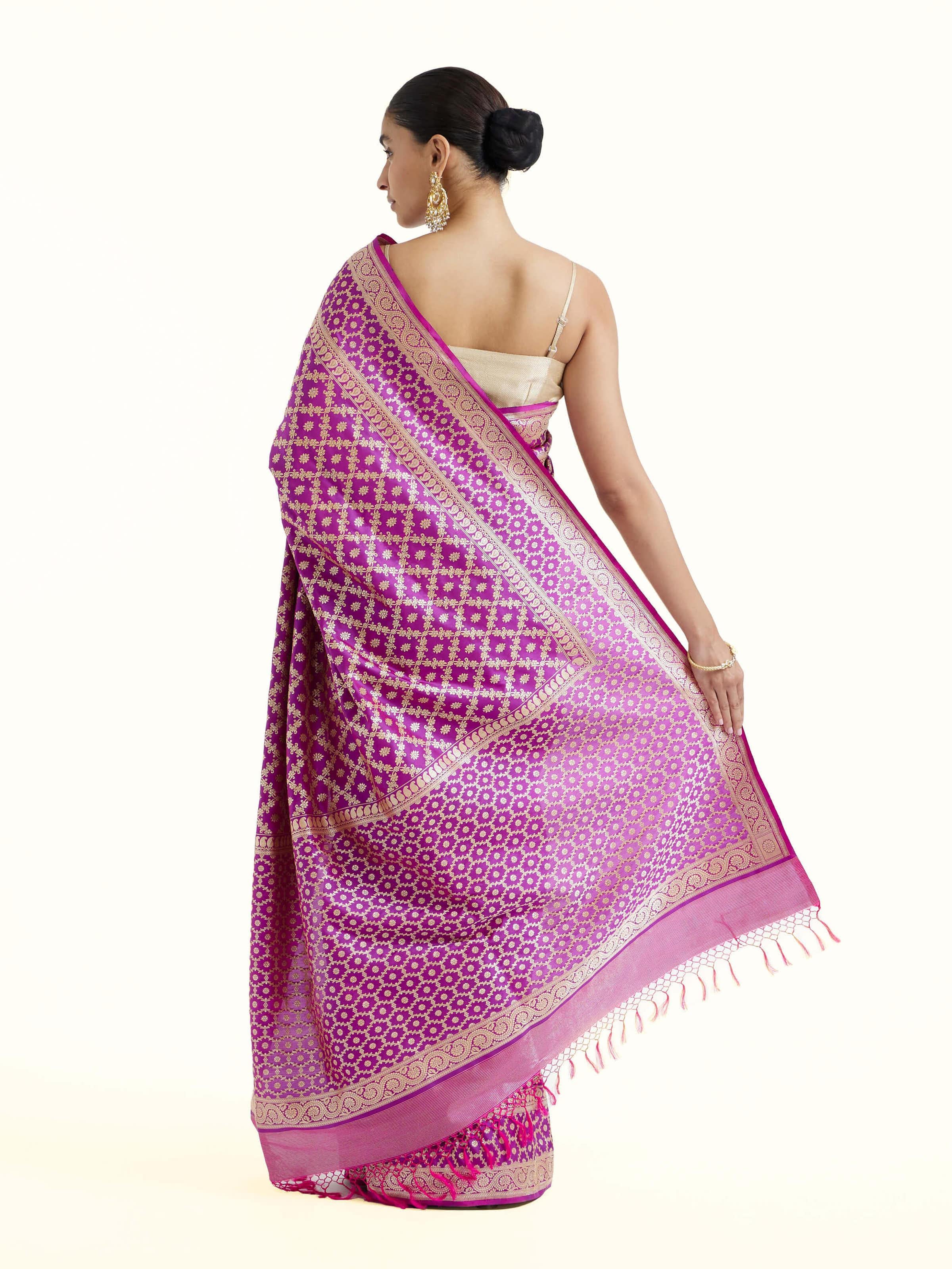 Back view of purple katan mulberry silk Banarasi saree displaying elaborate pallu