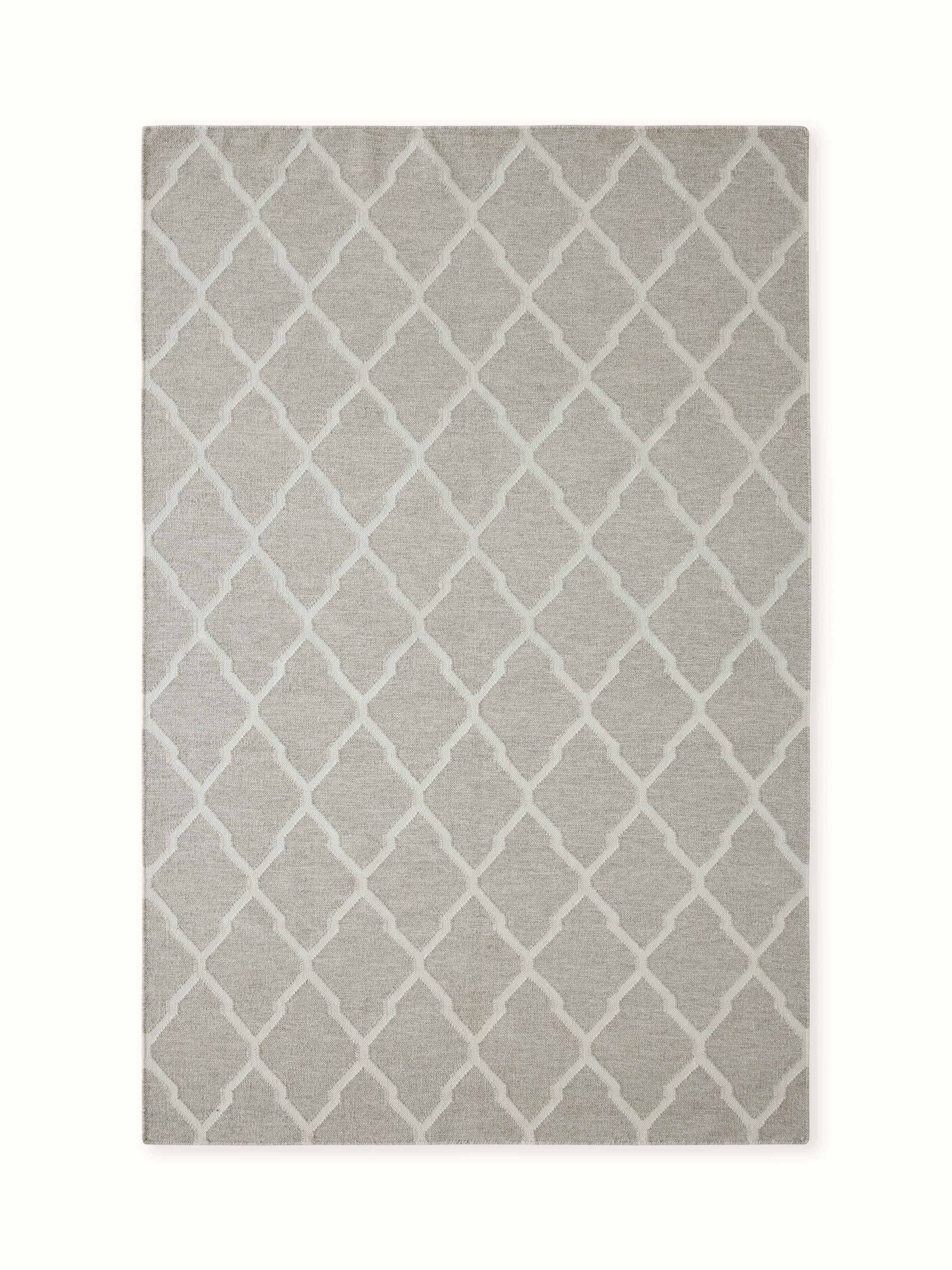 Front view showcasing the modern geometric pattern in grey and ivory melange wool