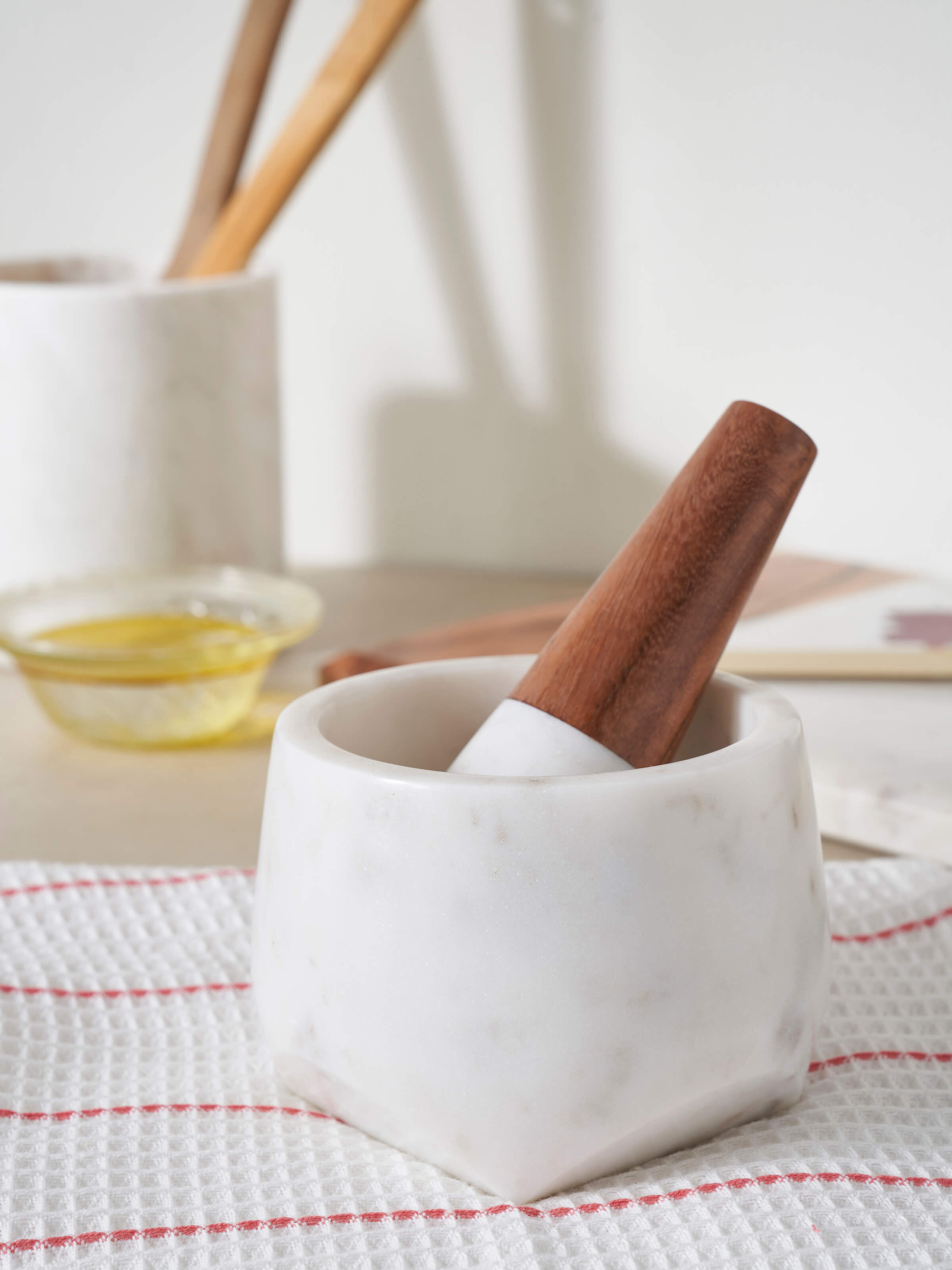 Side view of Carved marble mortar & pestle highlighting craftsmanship