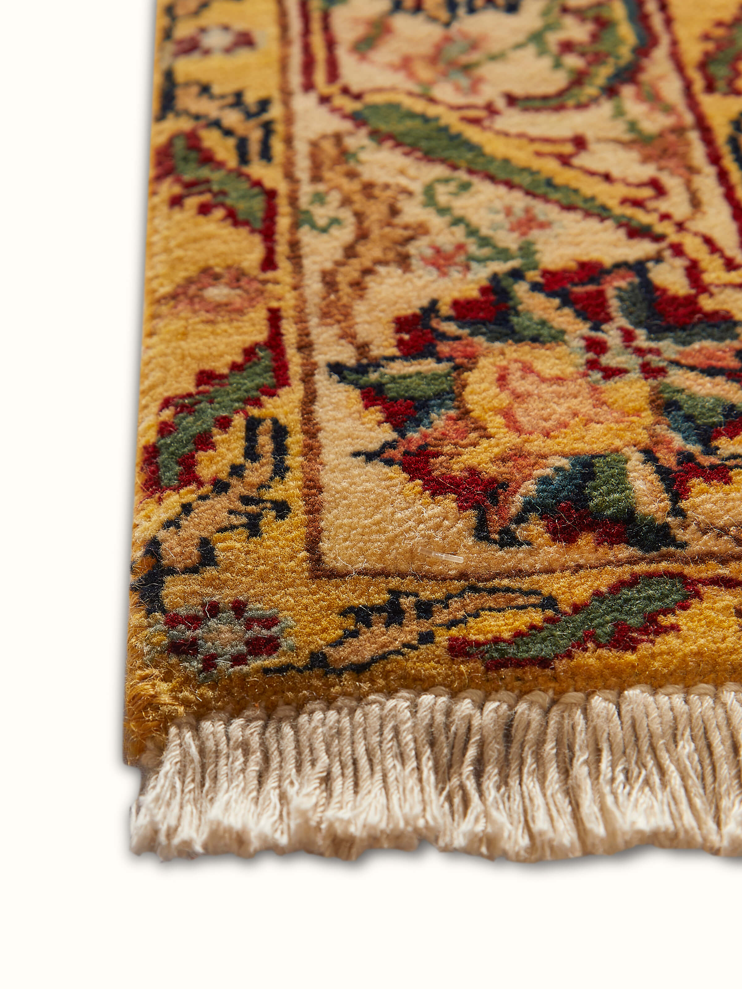 Angled view of Ziegler traditional red Jaipur wool hand-knotted carpet showing the depth of color and texture