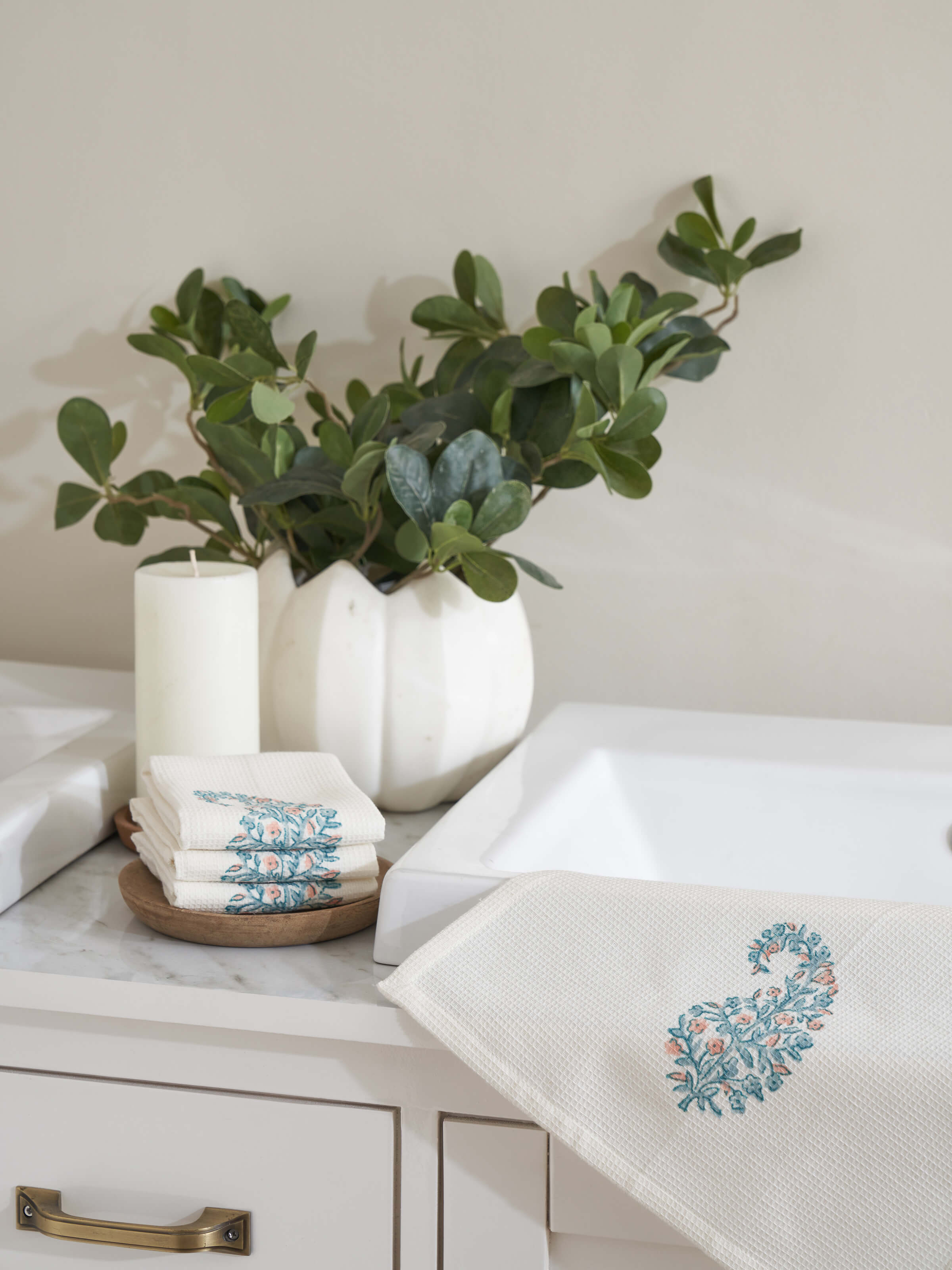 Side view of Ambi buta blue floral cotton Sanganeri block printed face towels highlighting the towel's edges and design