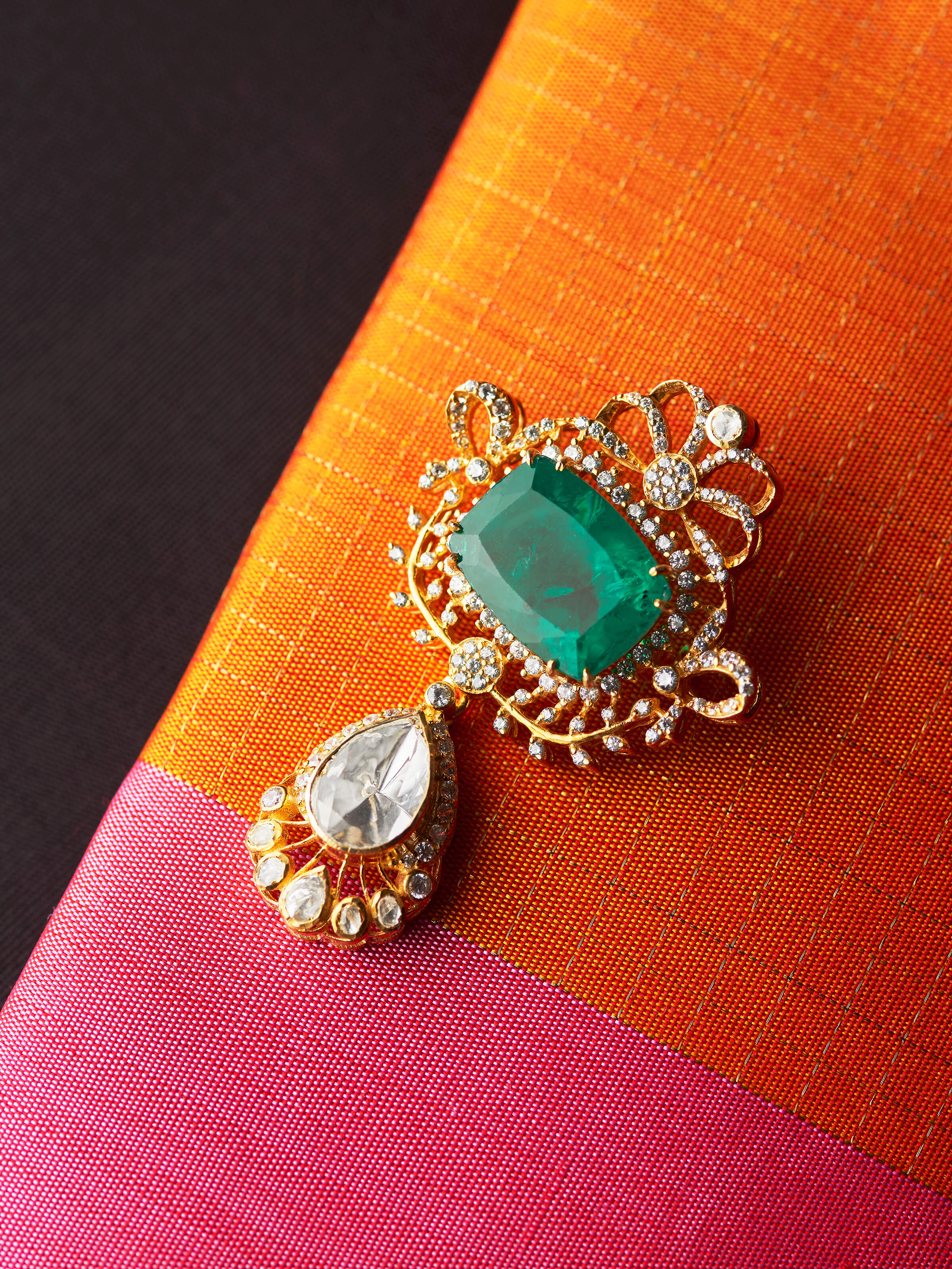 detail view of silver smithing yellow gold brooch pin design