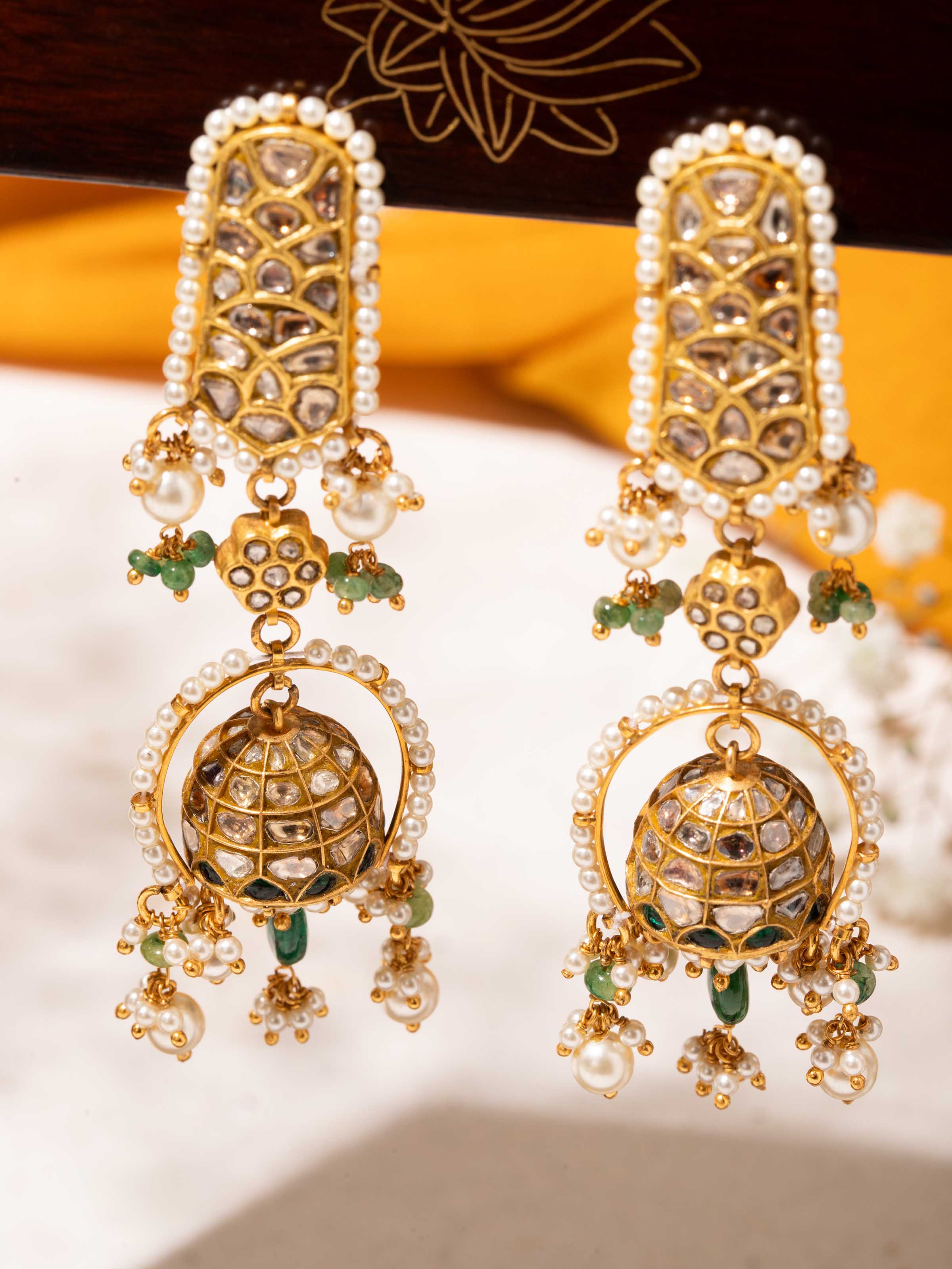 Detailed view of Thappa 22 karat gold drop earrings emphasizing fine craftsmanship and cultural artistry