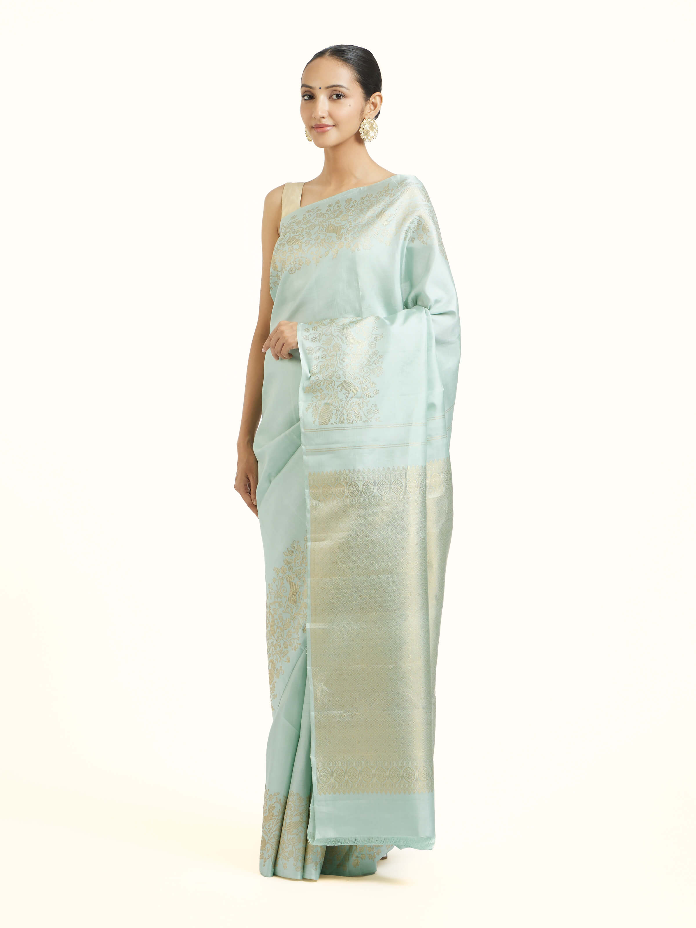 Side view of blue silk Kancheepuram saree highlighting structured drape and border