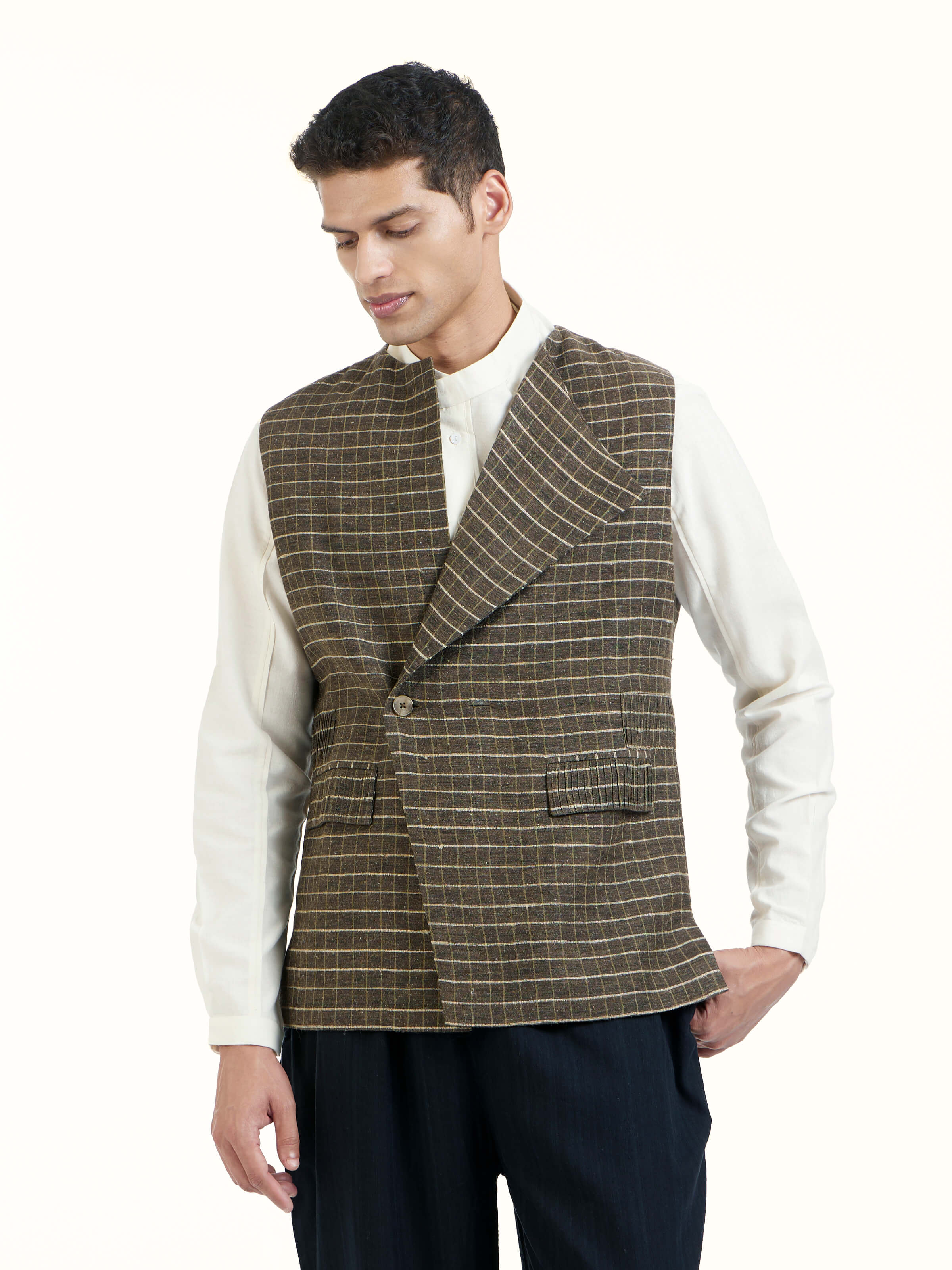 Angled view of brown handloom sleeveless jacket highlighting handcrafted weave texture