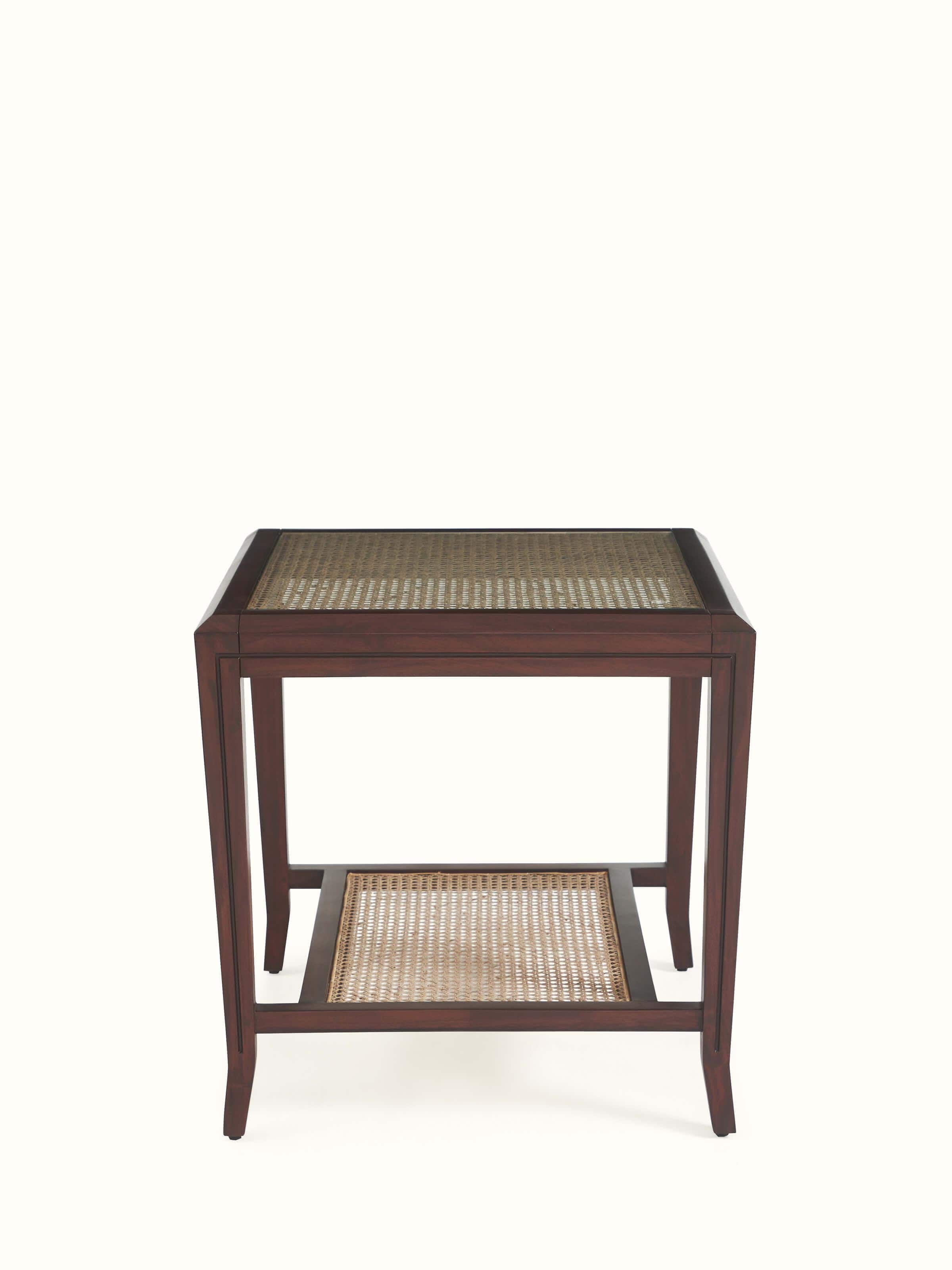 Angled view showcasing round mahogany table top and carved legs – premium Indian furniture design