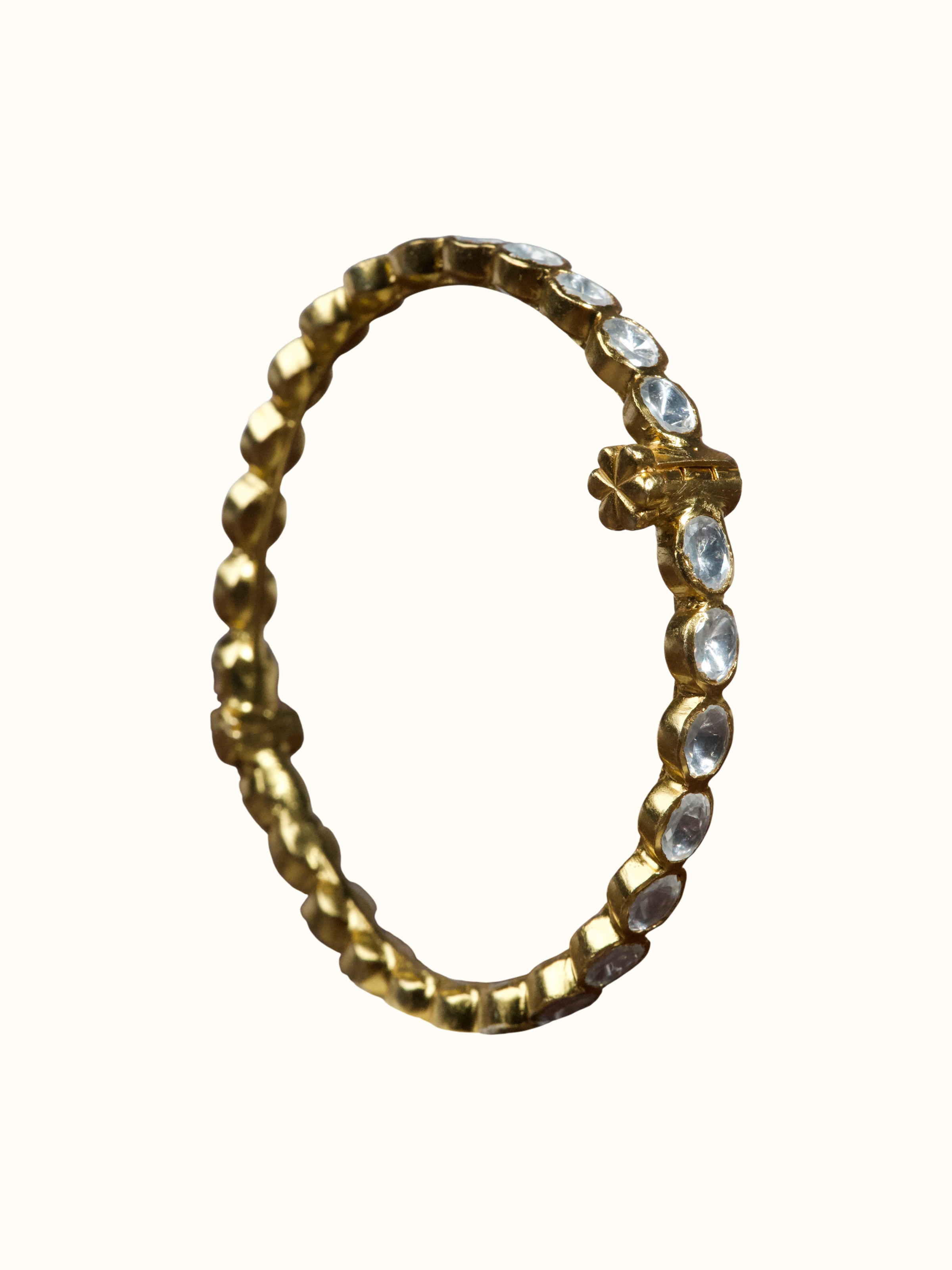 angled view of silver smithing multi-colour bangle