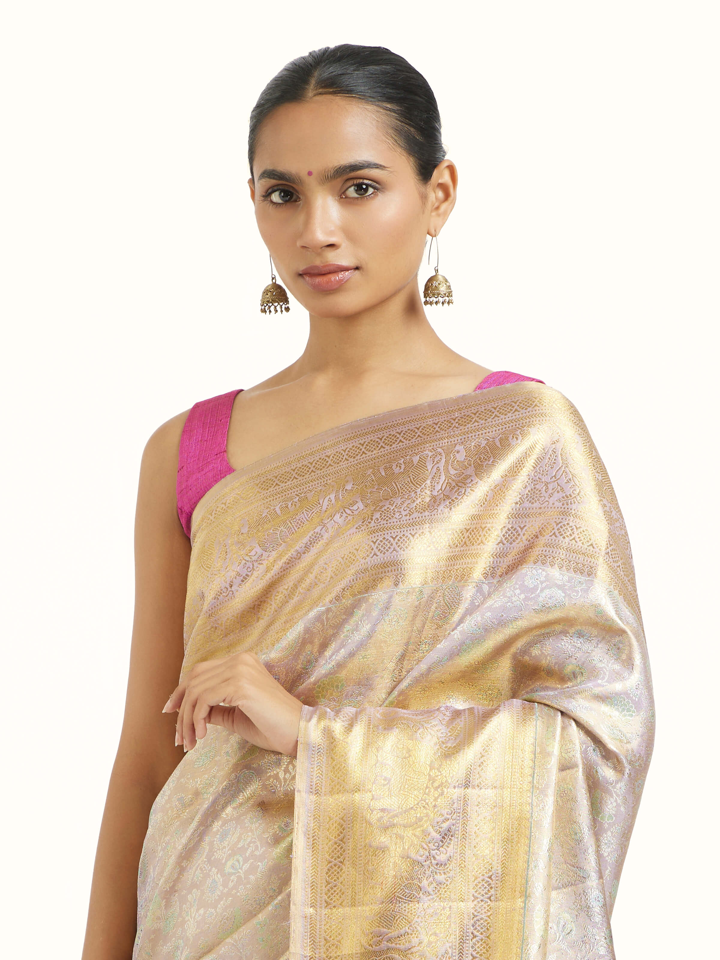 Angled view of silver silk Kancheepuram saree highlighting traditional weave