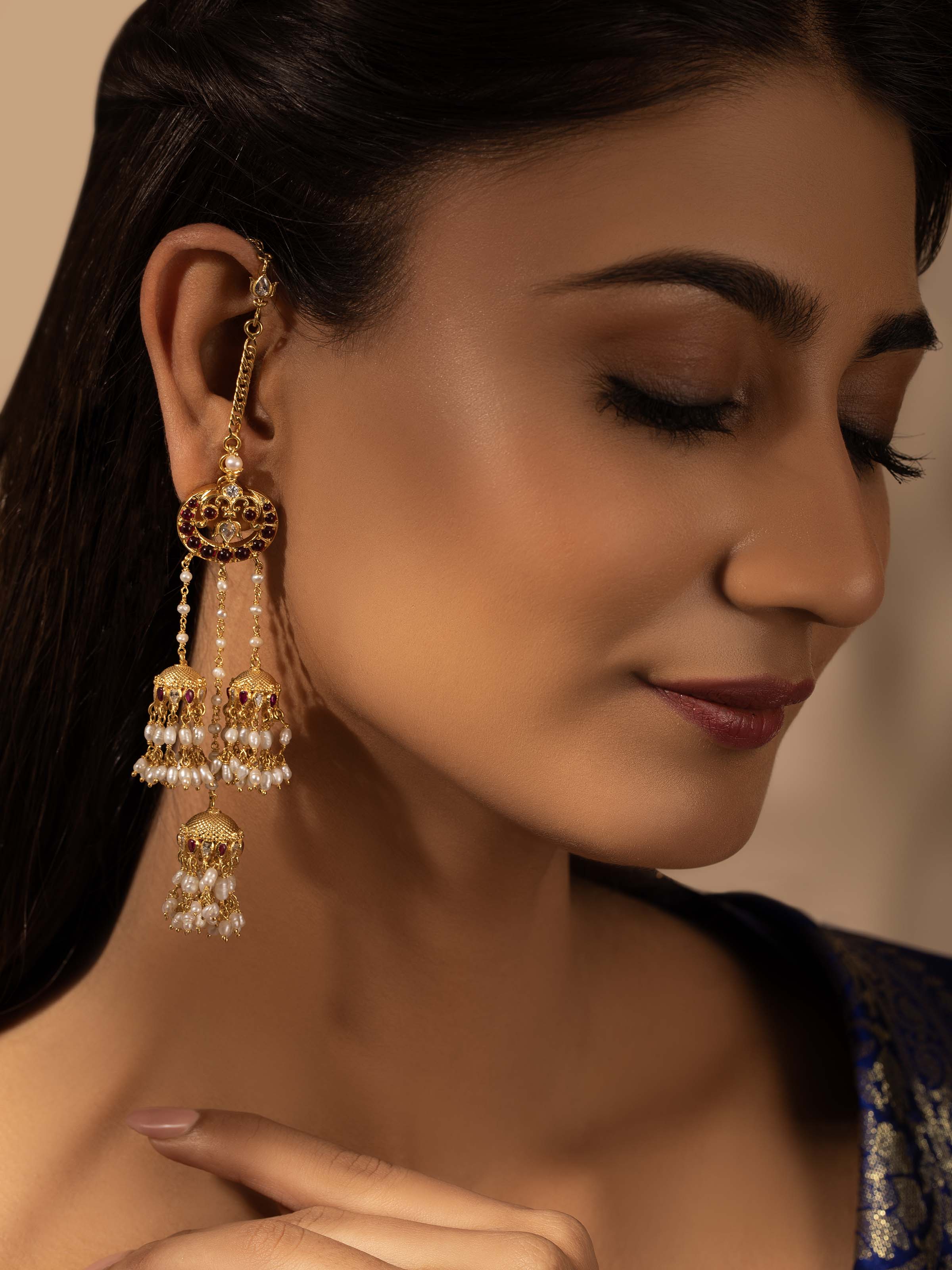 Side view of Guttapusalu silver drop earrings highlighting elegant curve and antique finish