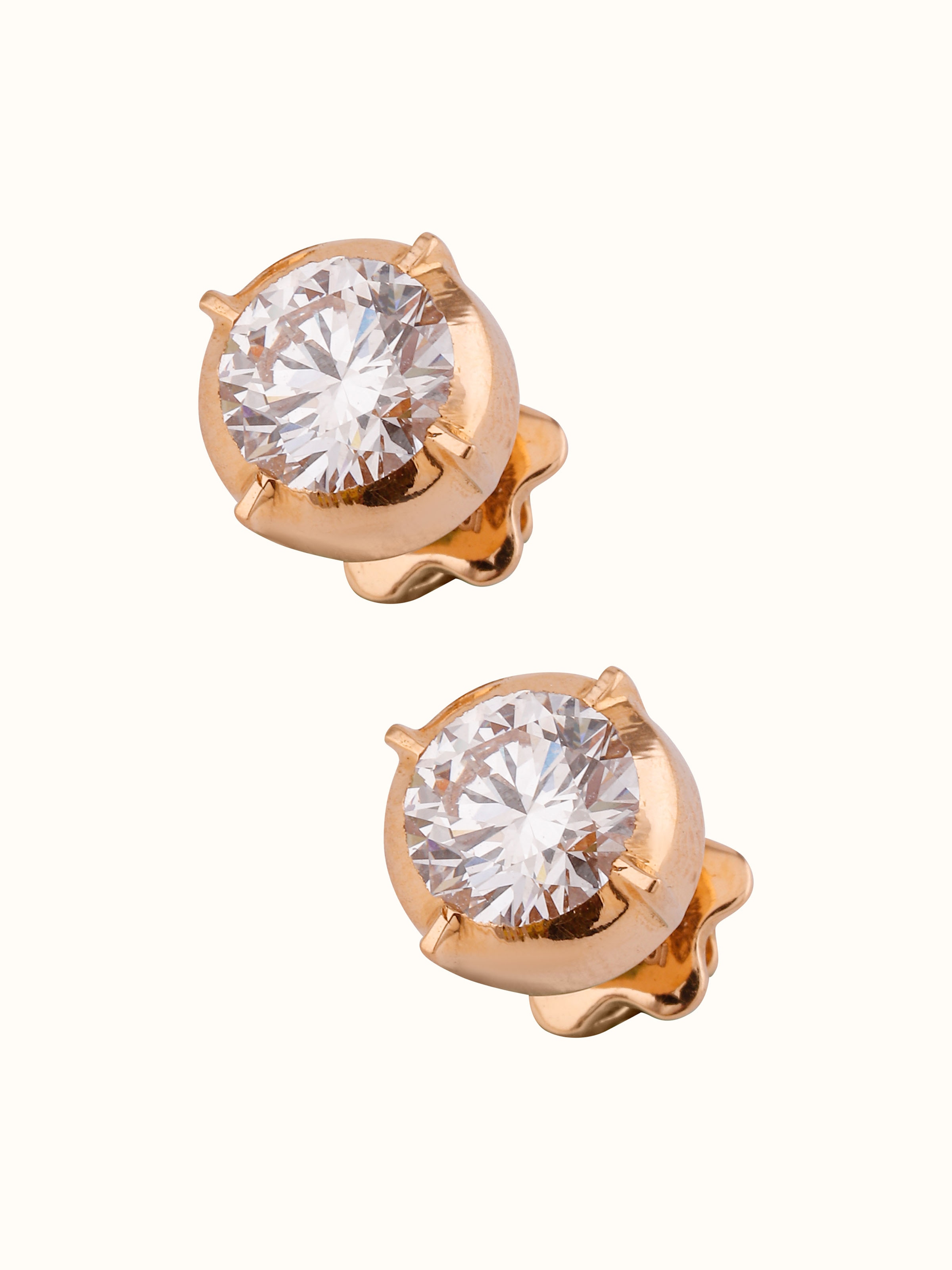 Overhead view of Swadesh Close-setting 22 Karat Gold Studs capturing symmetrical design and timeless elegance