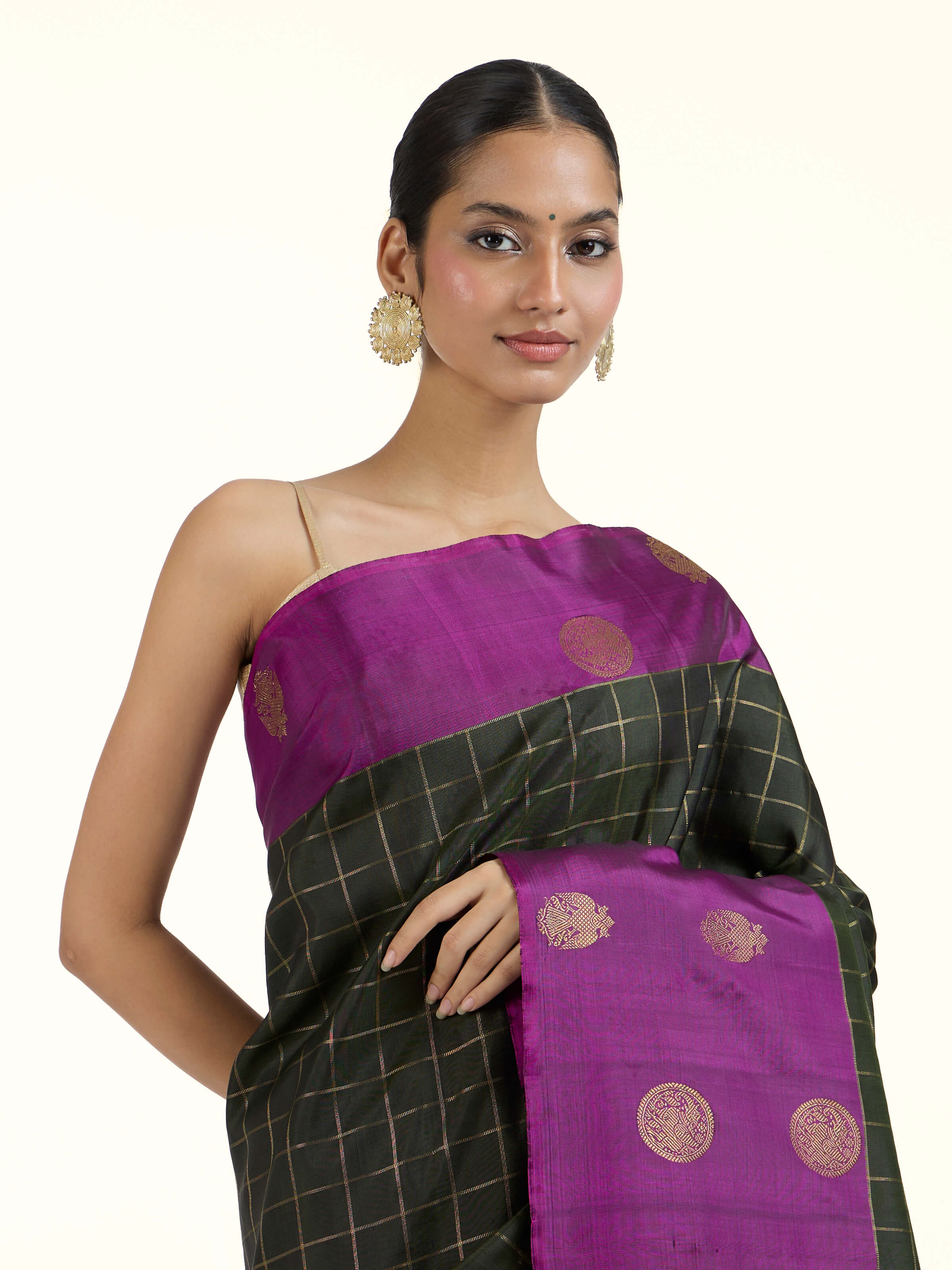 Angled view of black silk Kancheepuram saree highlighting silk sheen and weave
