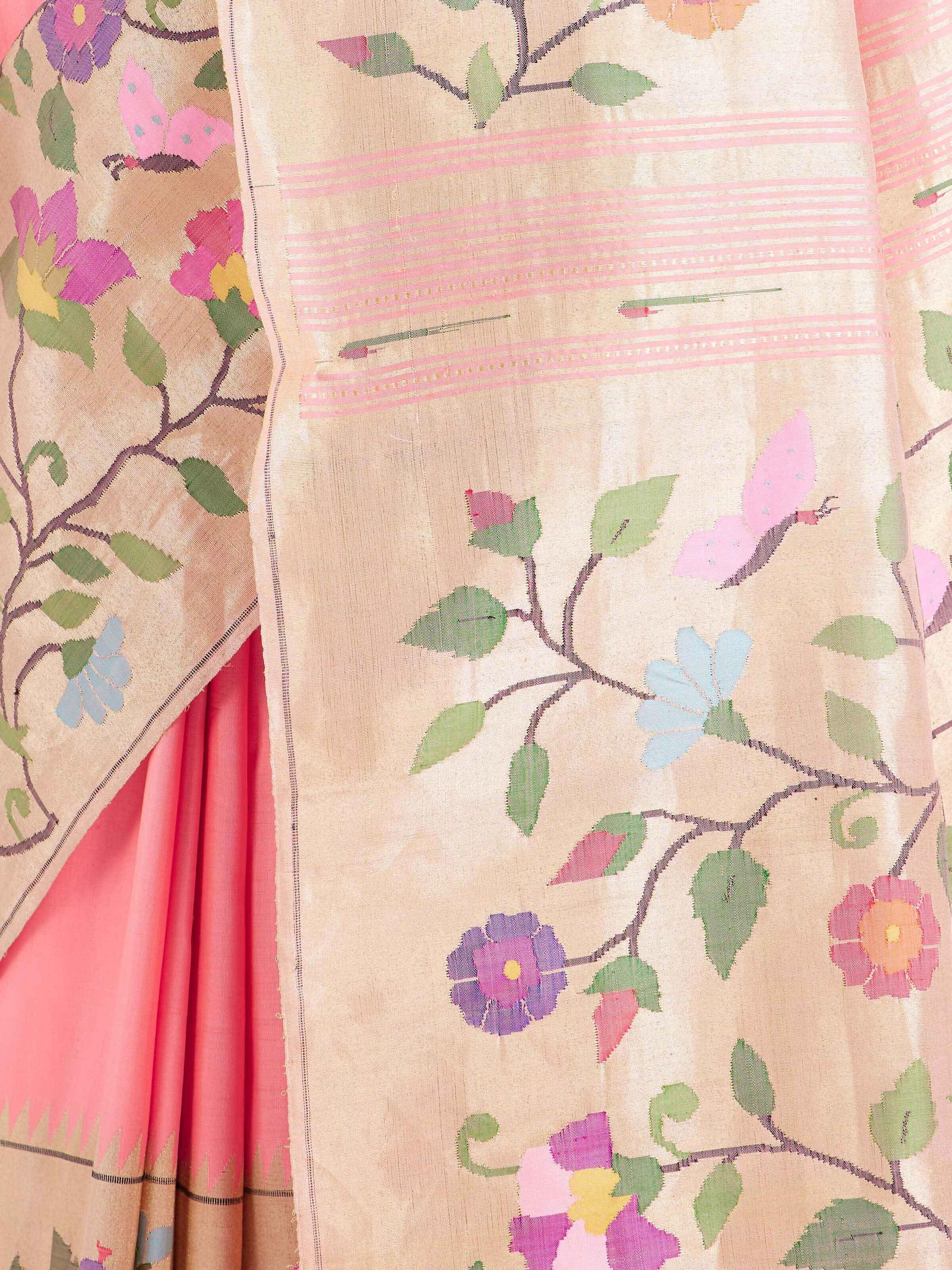Detail view of pink silk Paithani saree showing silk texture and zari work