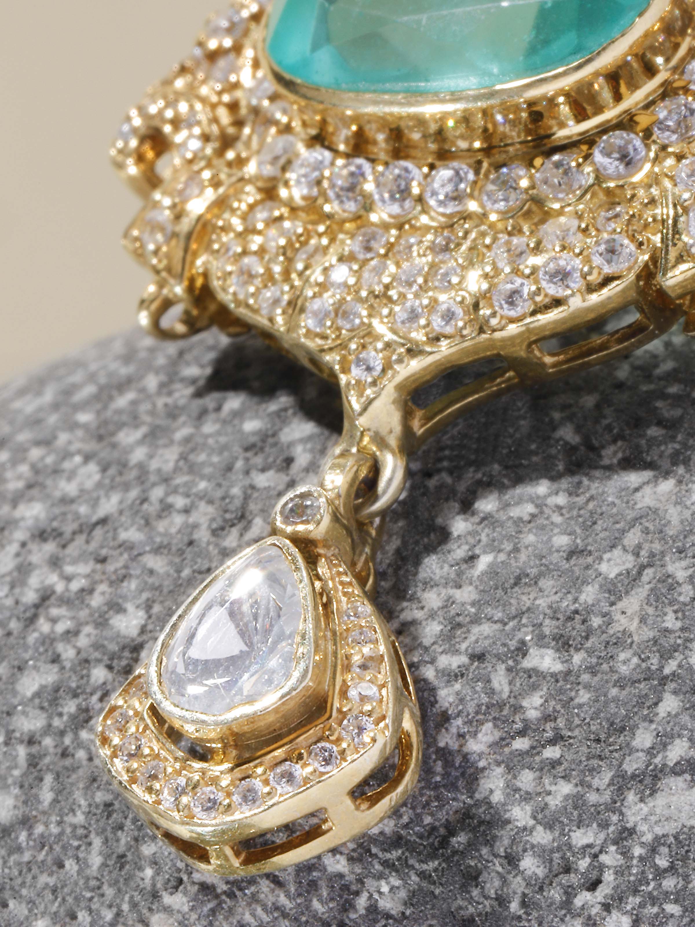 Close-up of handcrafted silver smithing detail on brooch pin