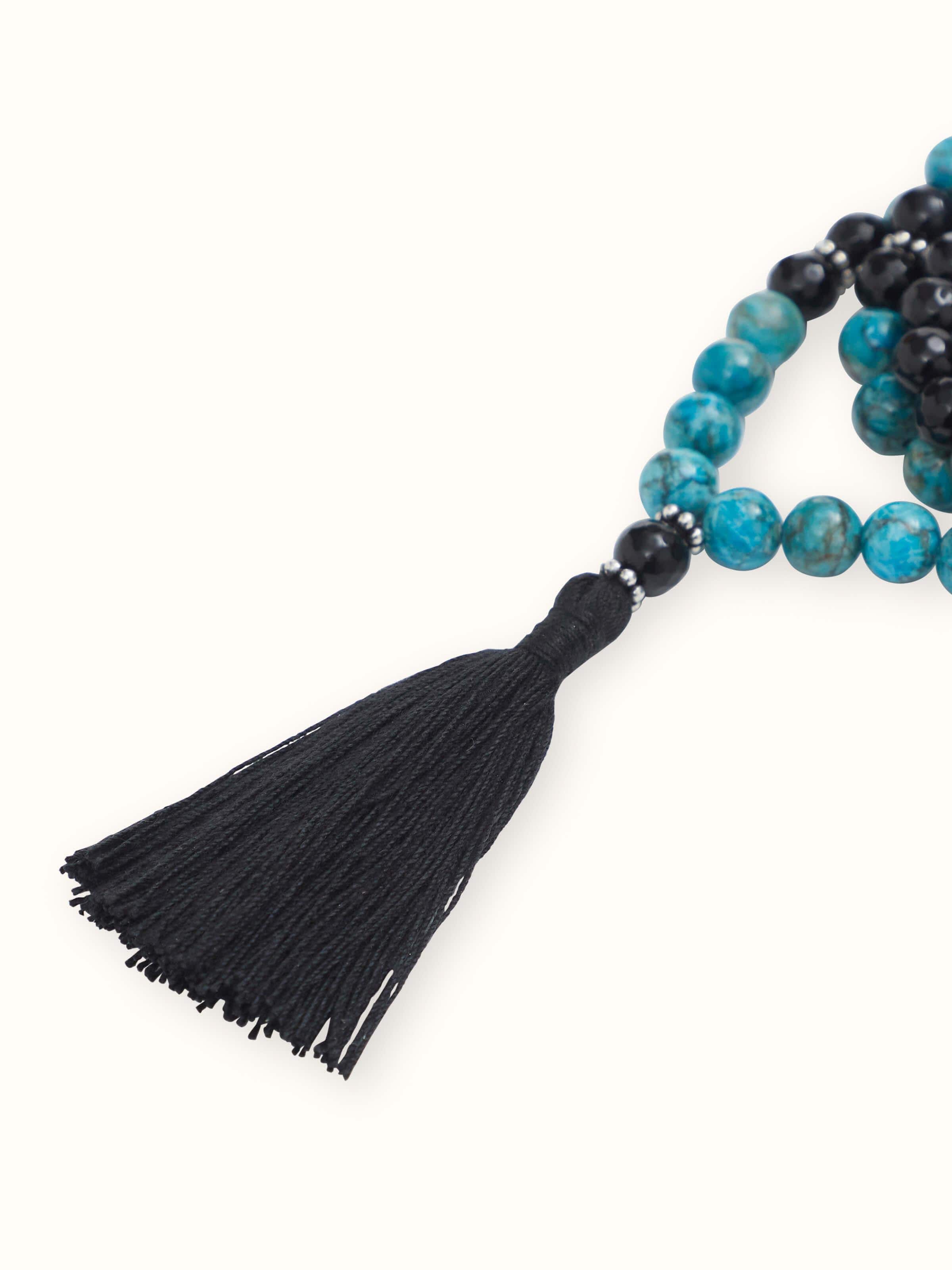 Diagonal display of Black Onyx & Turquoise Mala capturing the intricate arrangement and rich colors