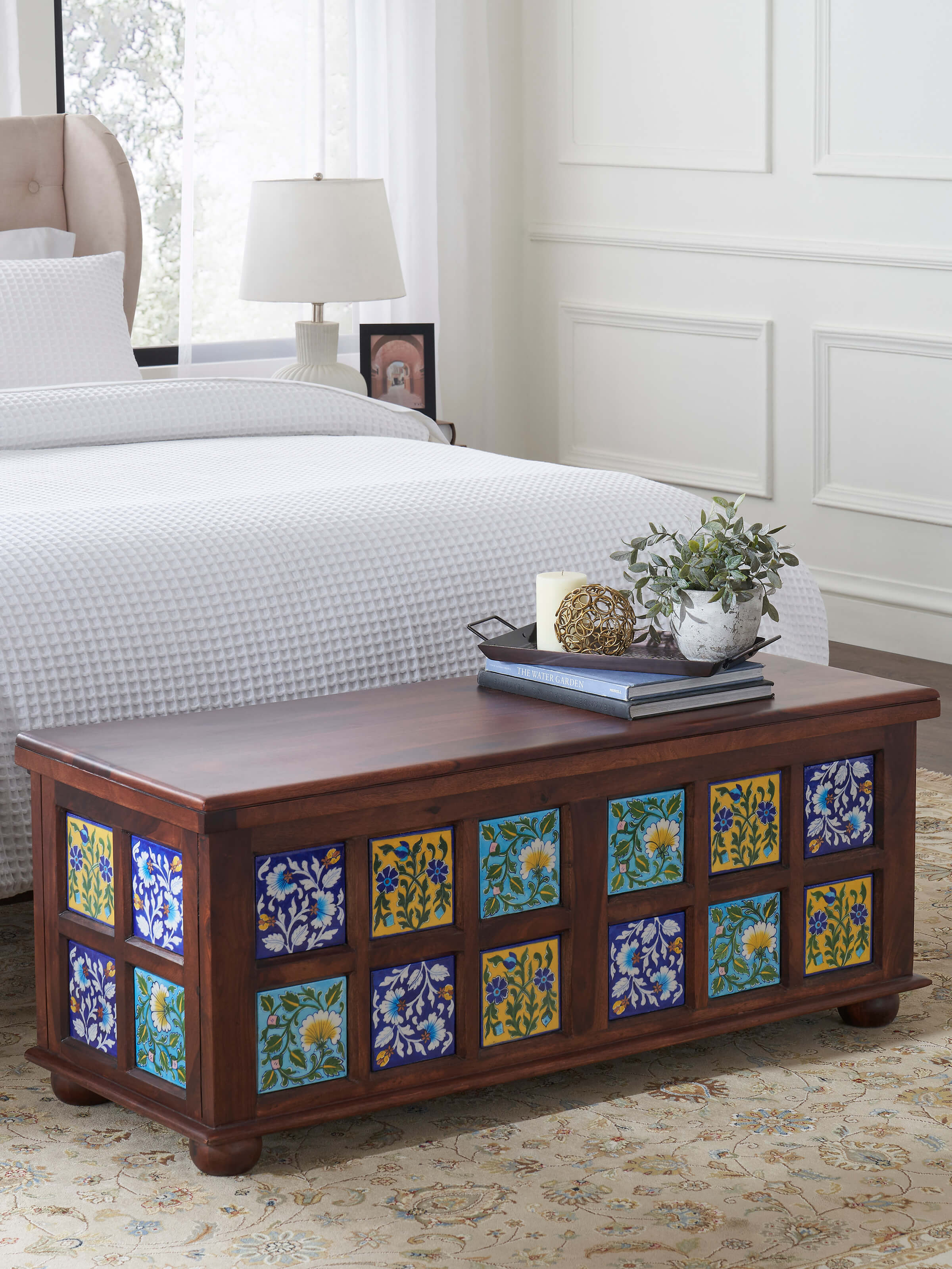 Front view of the Sheesham wood trunk featuring detailed blue pottery, showcasing the elegant design and craftsmanship.