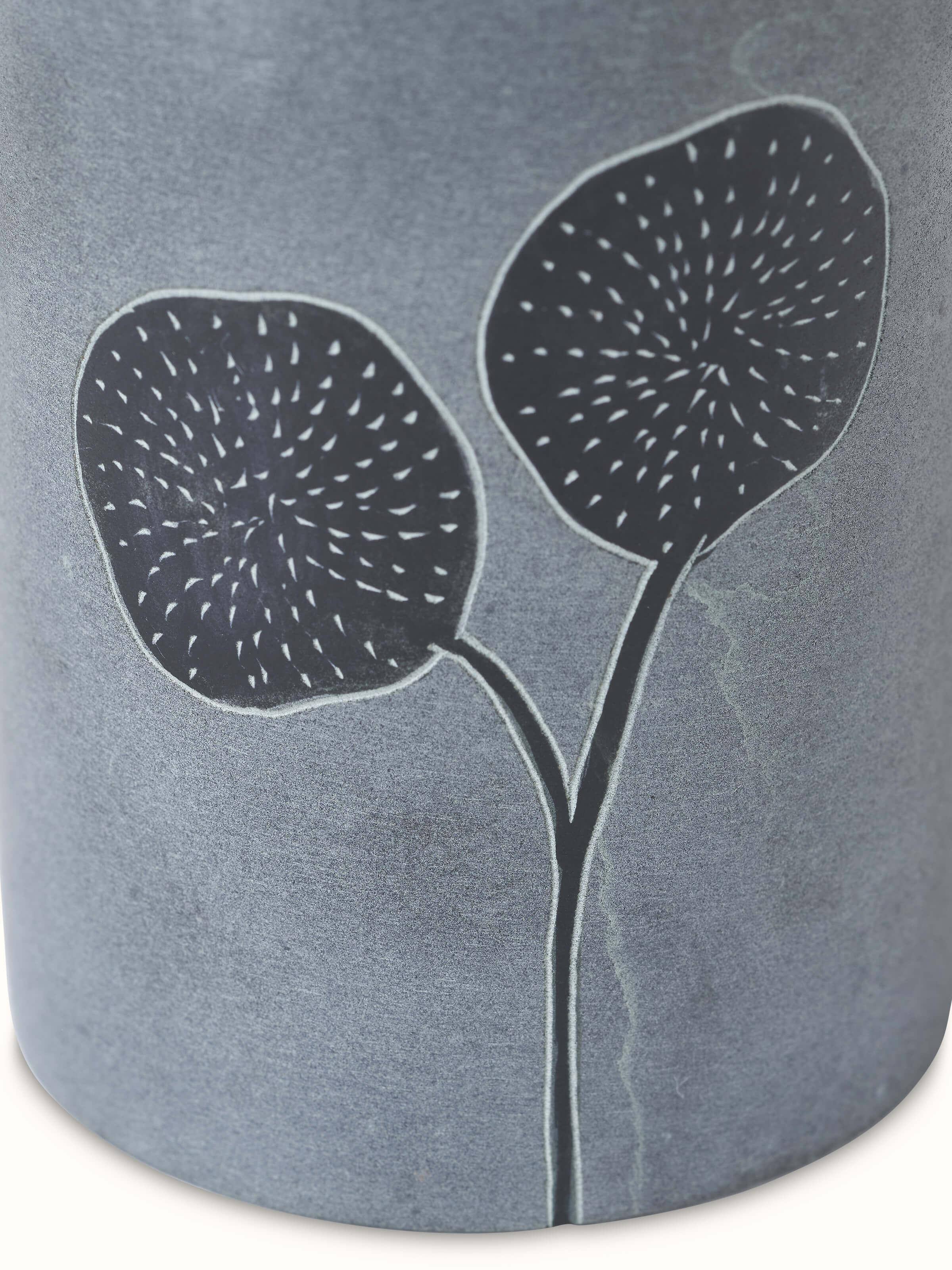 Artistic view of carved stone soap dispenser capturing the unique stone texture and detailed carving.