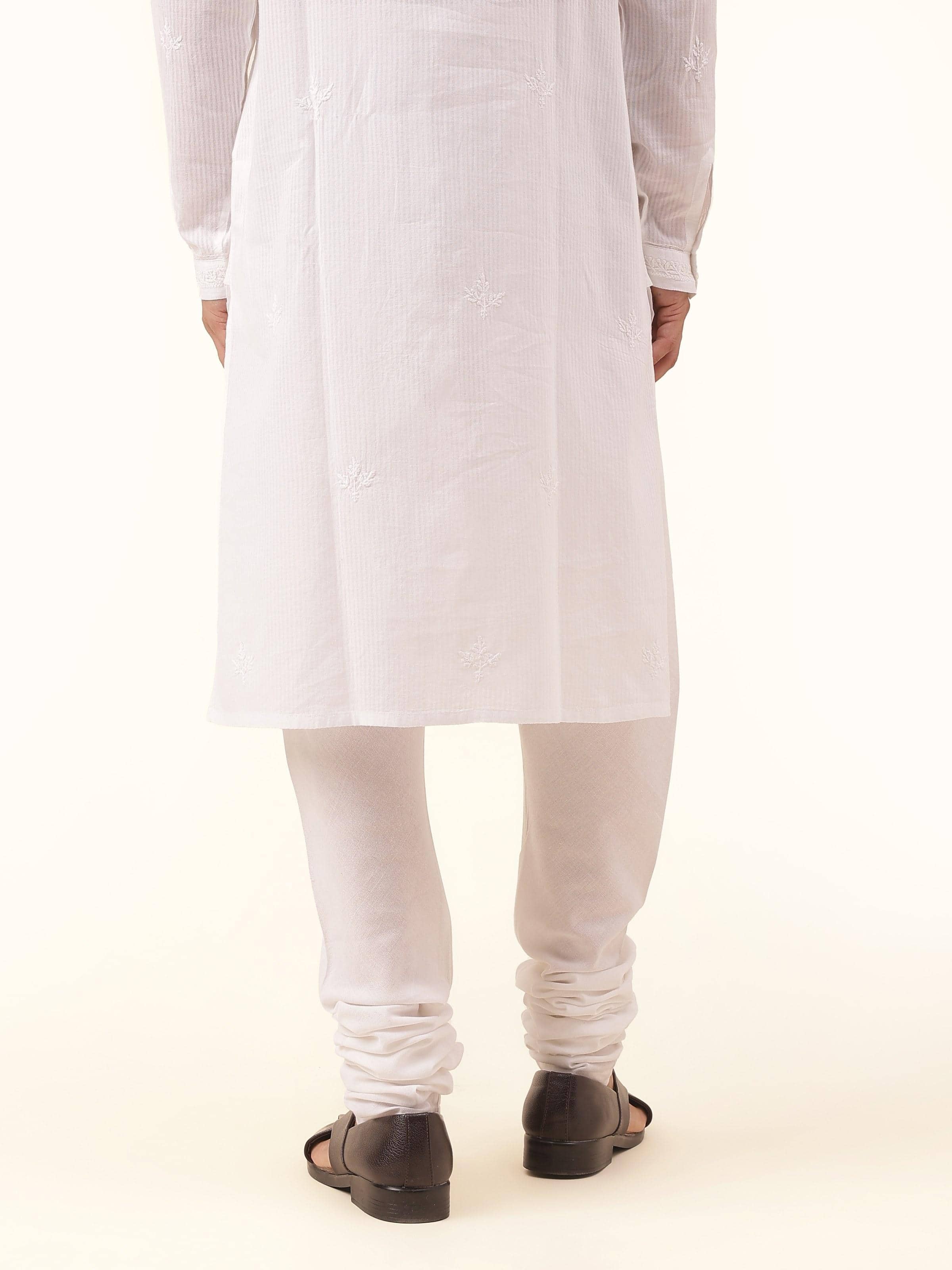 Back view of white cotton churidar with elasticated waistband and clean finishing.